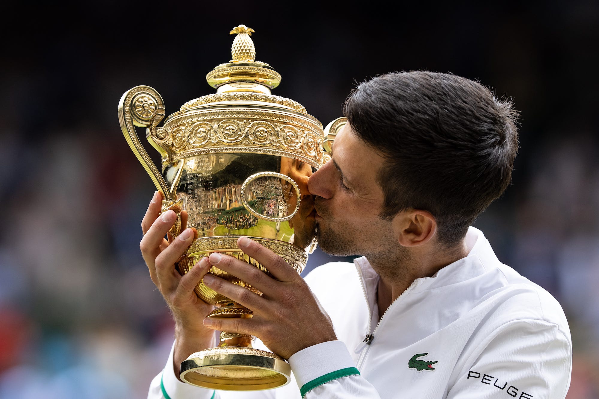 Novak Djokovic celebrates winning Wimbledon 2021