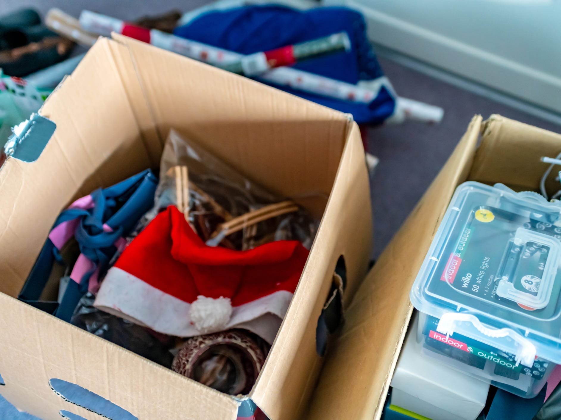 Items stored in open cardboard boxes.