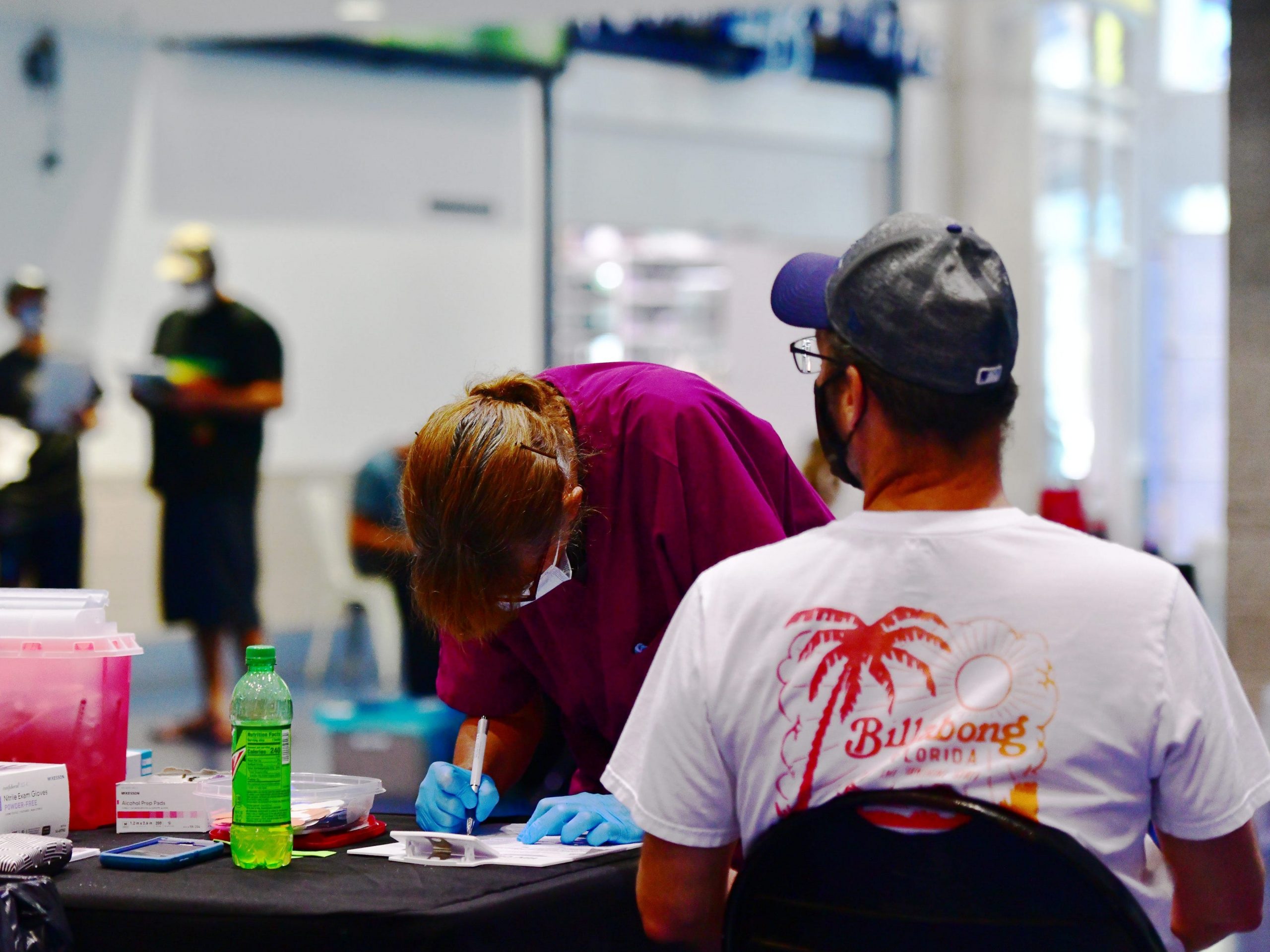 A nurse prepares paperwork with a patient during the Vaccinate at the Plate event at Tropicana Field on June 16, 2021 in St Petersburg, Florida.