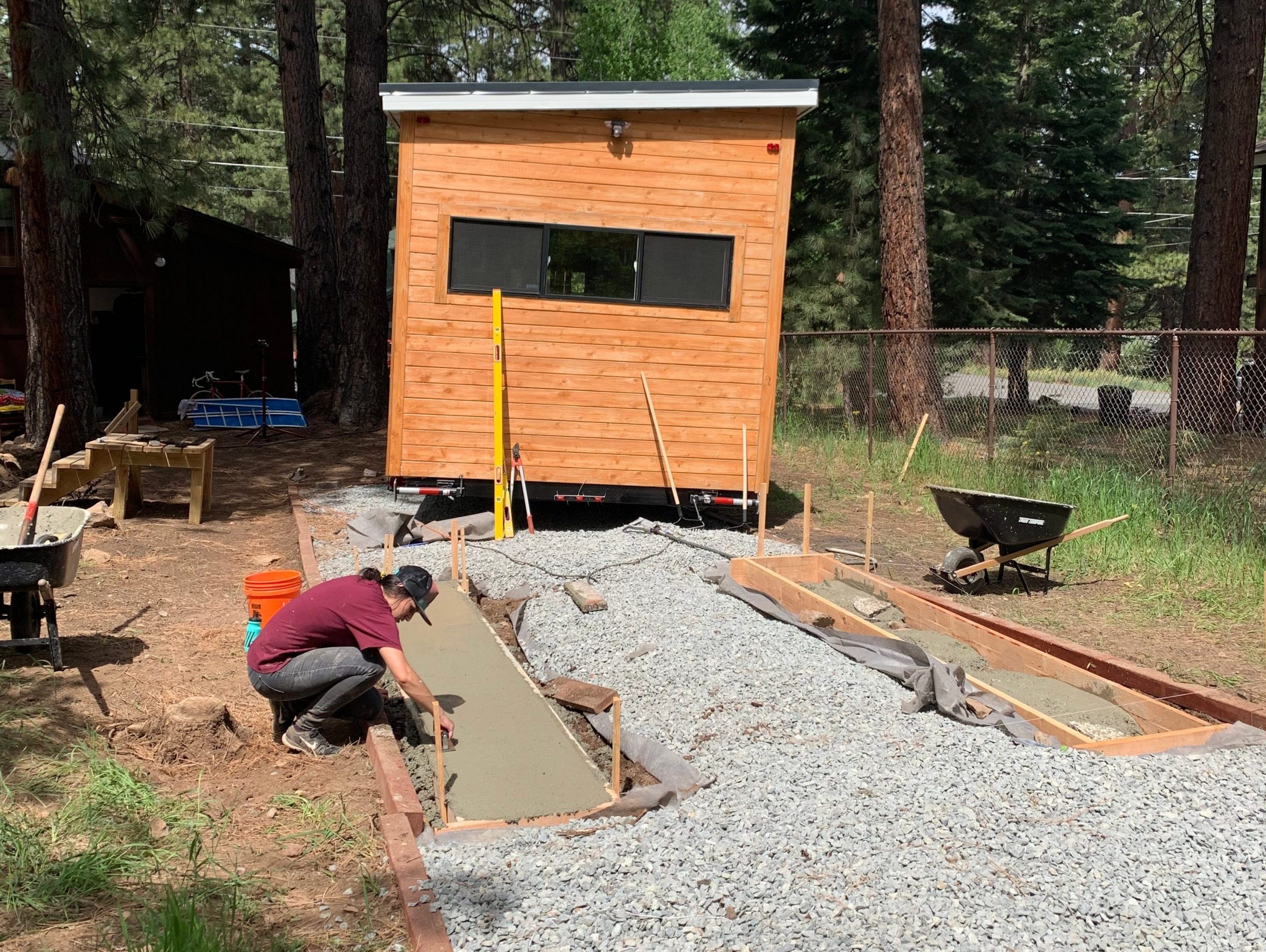 exterior shot of people building a tiny house