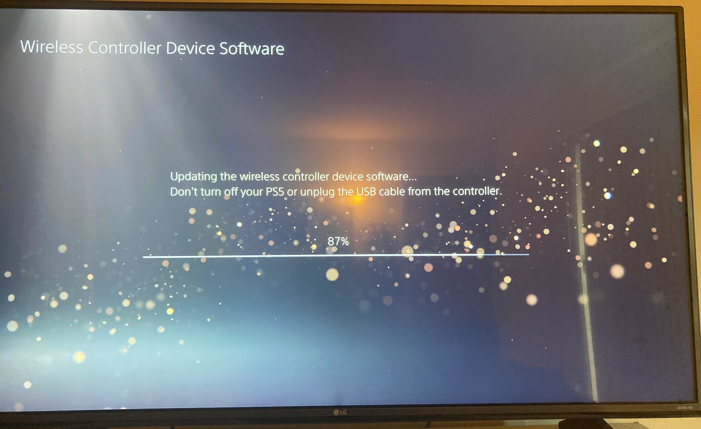 A screen saying that the PS5 controller is updating.