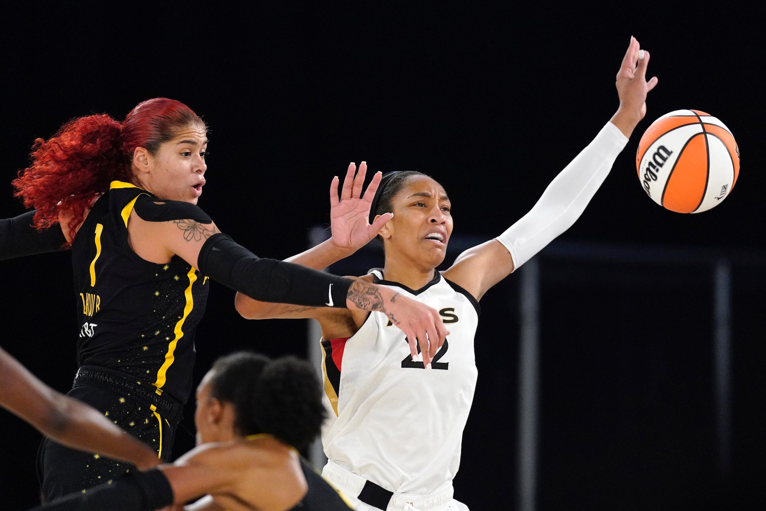 Amanda Zahui B blocks a shot from reigning WNBA MVP A'ja Wilson.