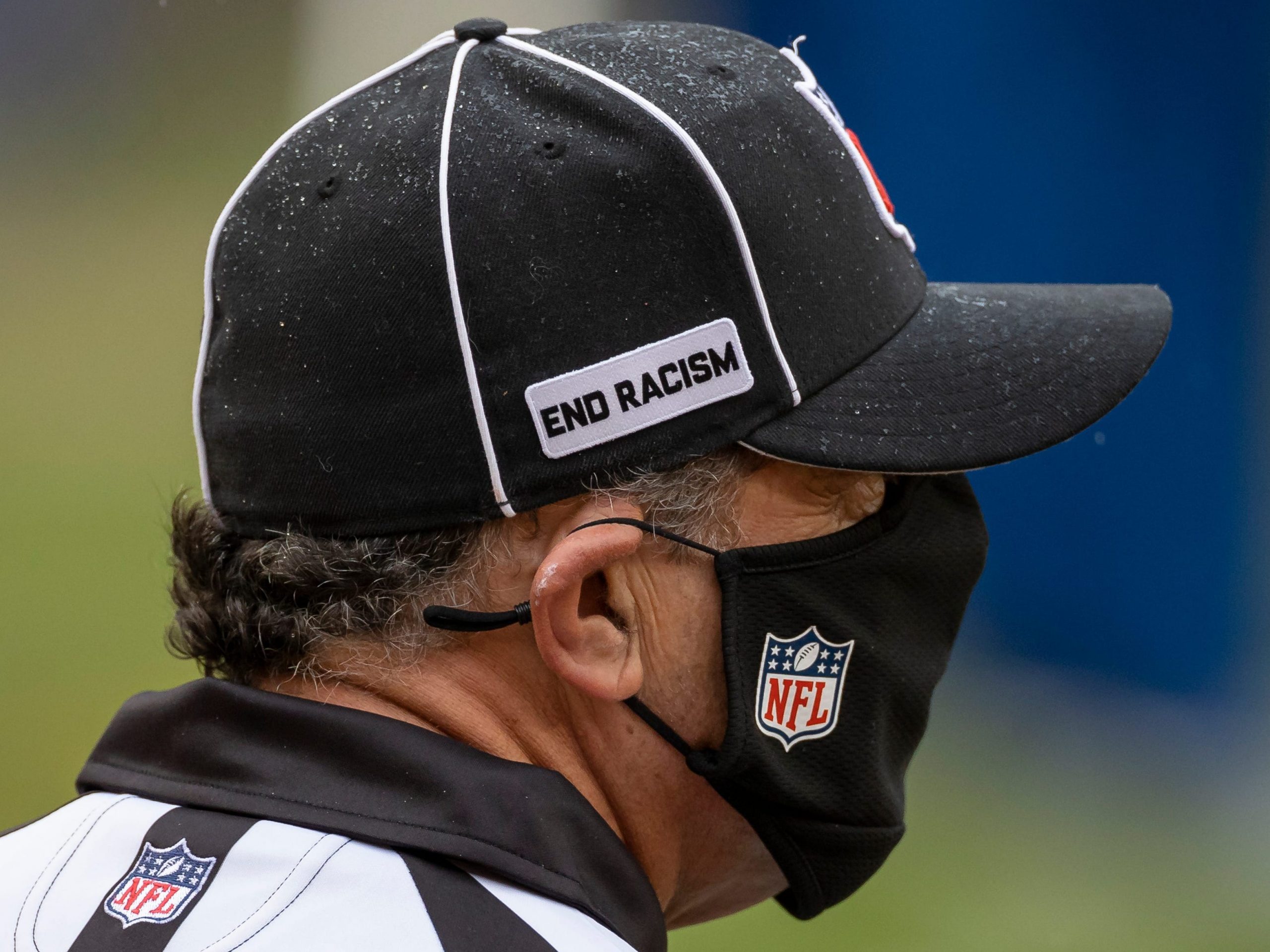 Down Judge Jim Mello #48 looks on while wearing a heat with an "End racism" logo during the first half of the game between the Washington Football Team and the Dallas Cowboys at FedExField on October 25, 2020 in Landover, Maryland.