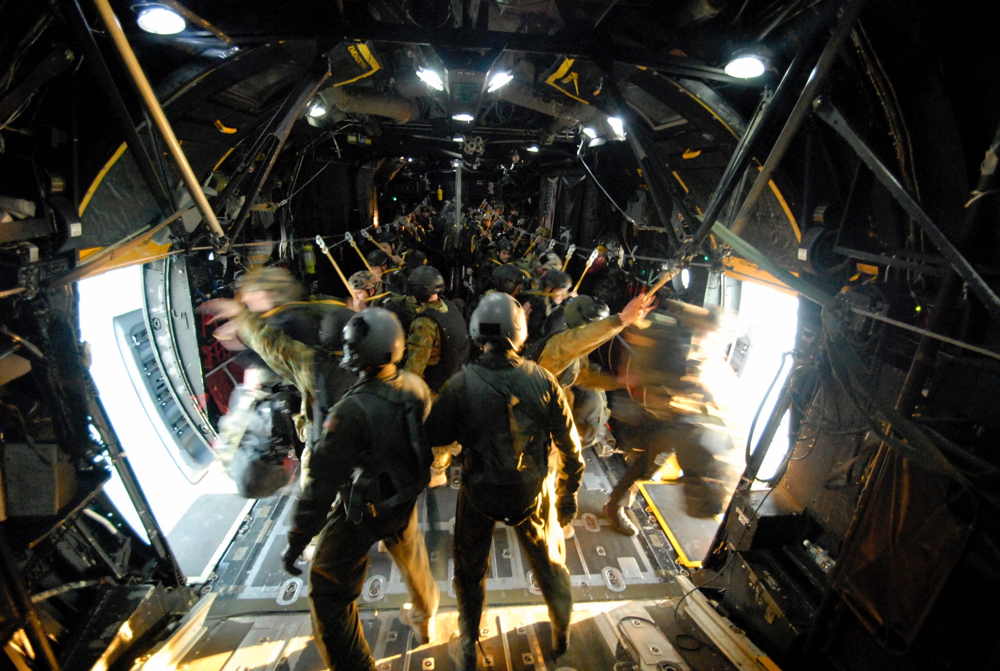 Australian special forces paratroopers jump from US MC-130 aircraft