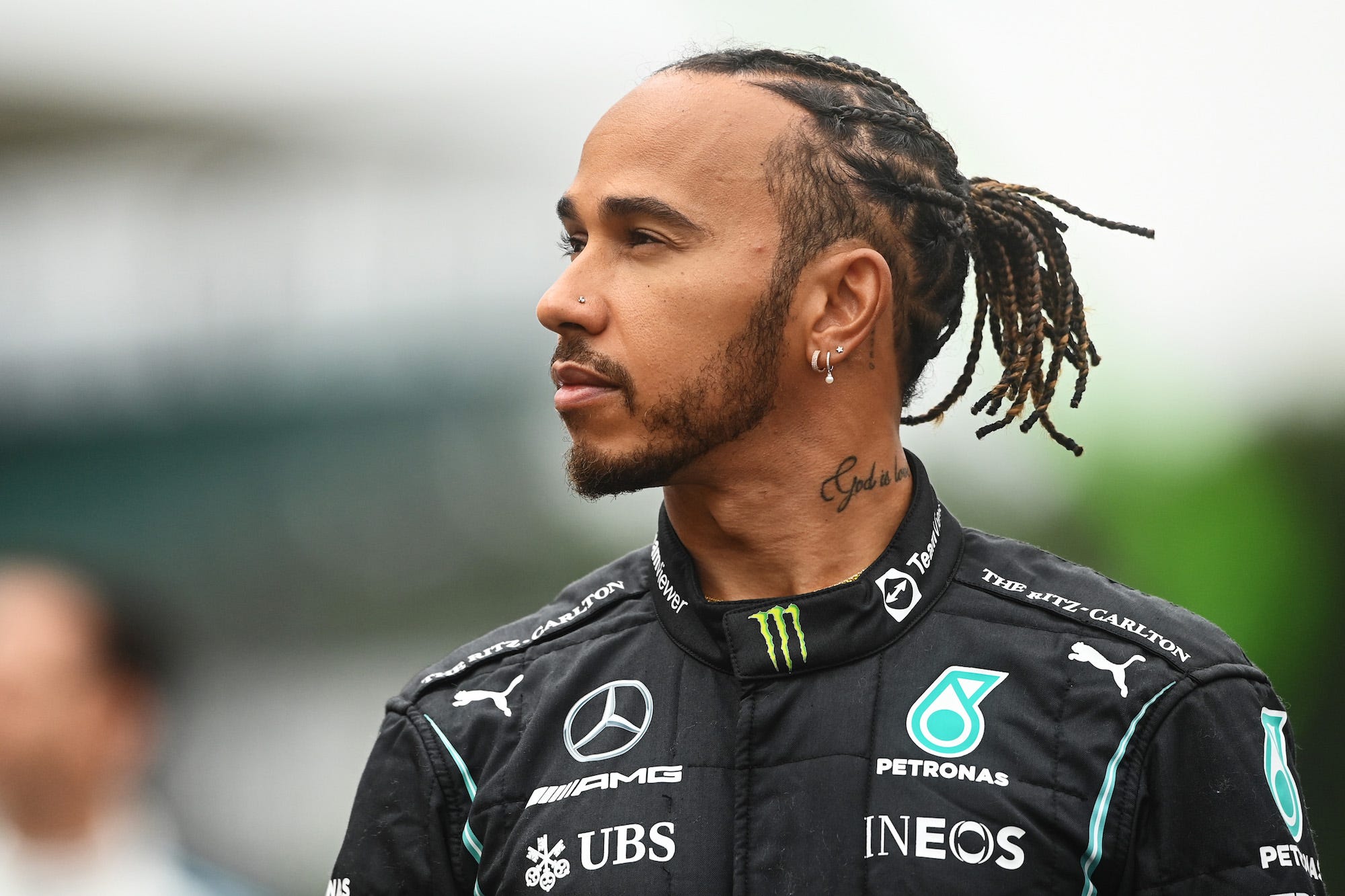 Lewis Hamilton of Great Britain and Mercedes GP looks on as the prototype for the 2022 F1 season is unveiled during previews ahead of the F1 Grand Prix of Great Britain at Silverstone on July 15, 2021 in Northampton, England