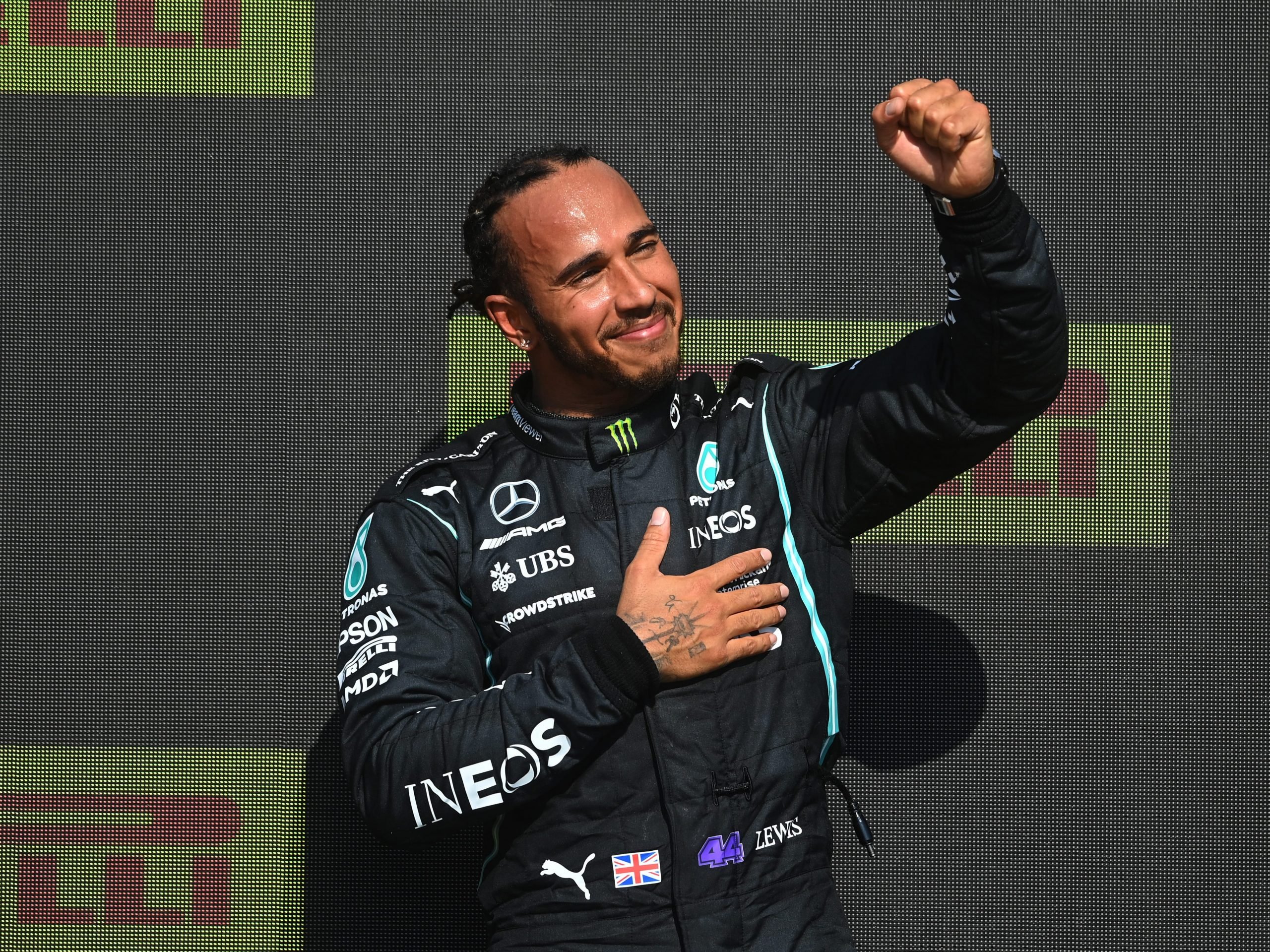 Lewis Hamilton raises his fist in celebration after winning the British Grand Prix