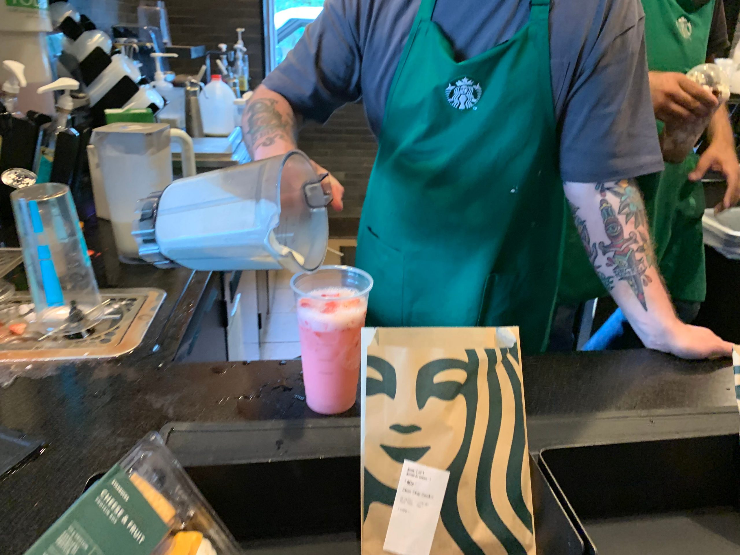 Starbucks Pink Drink Remixed being made by barista