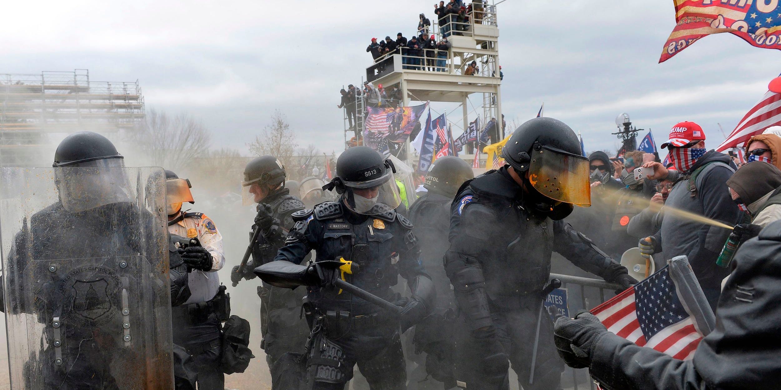 Trump supporters clash with police and security forces as they try to storm the US Capitol in Washington, DC on January 6, 2021.
