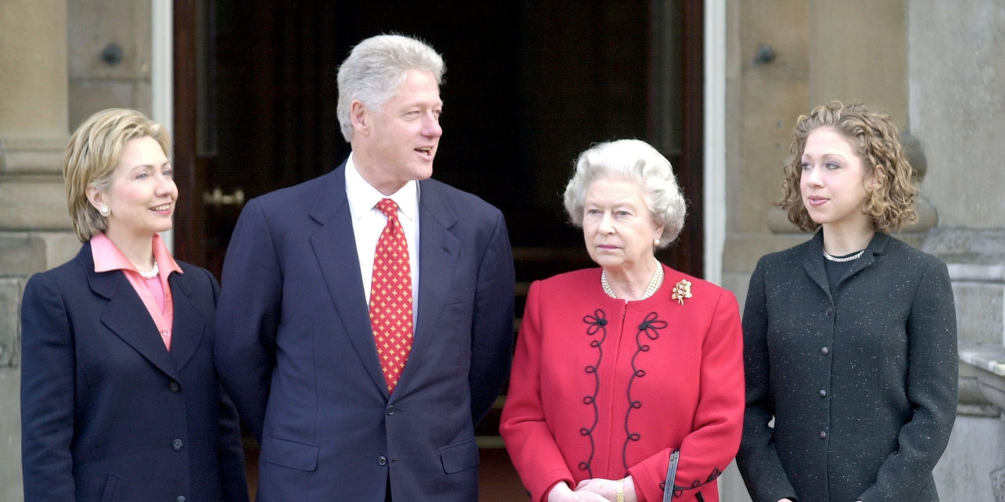 A photo of the Clinton family with Queen Elizabeth II