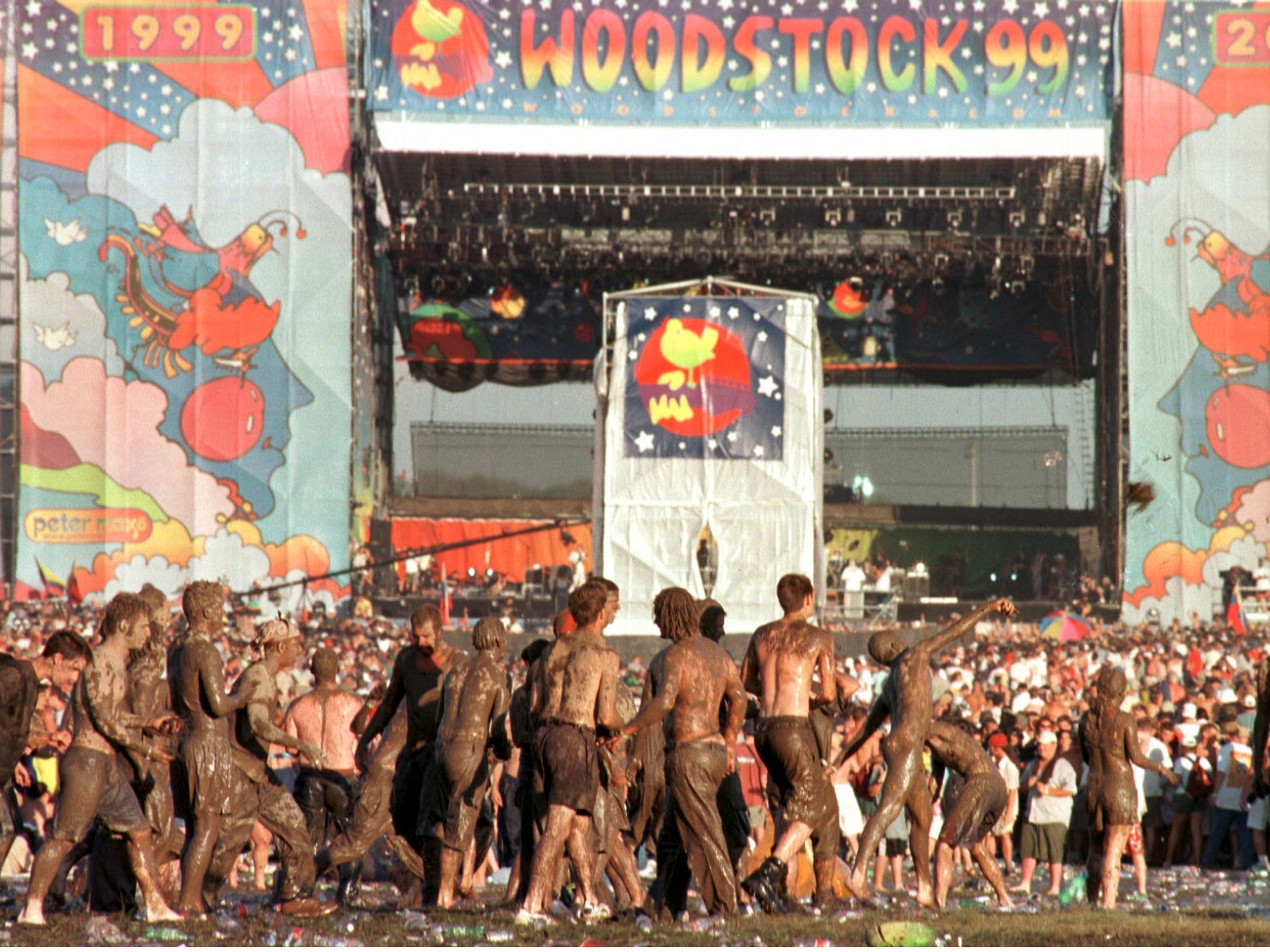 Attendees at Woodstock 99 covered in mud
