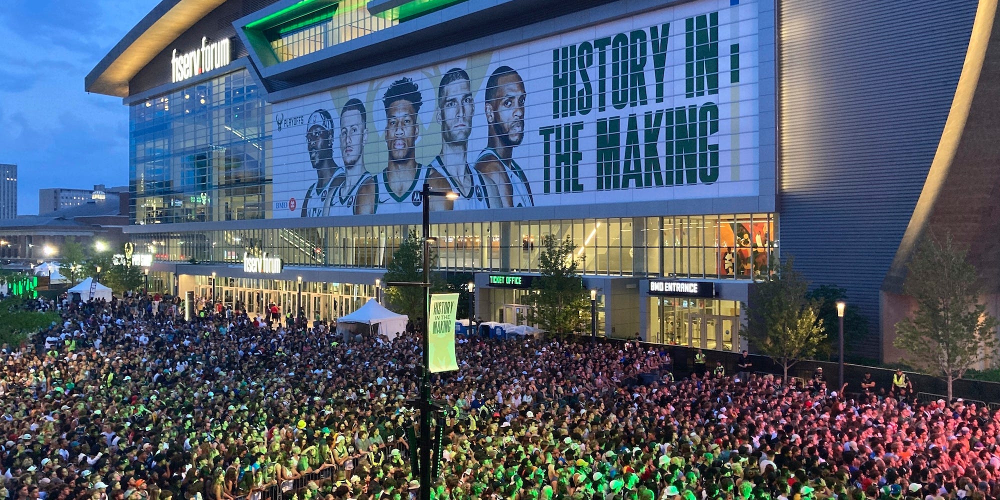Crowds gather outside the Milwaukee Bucks' Fiserv Forum in what is known as the Deer District.
