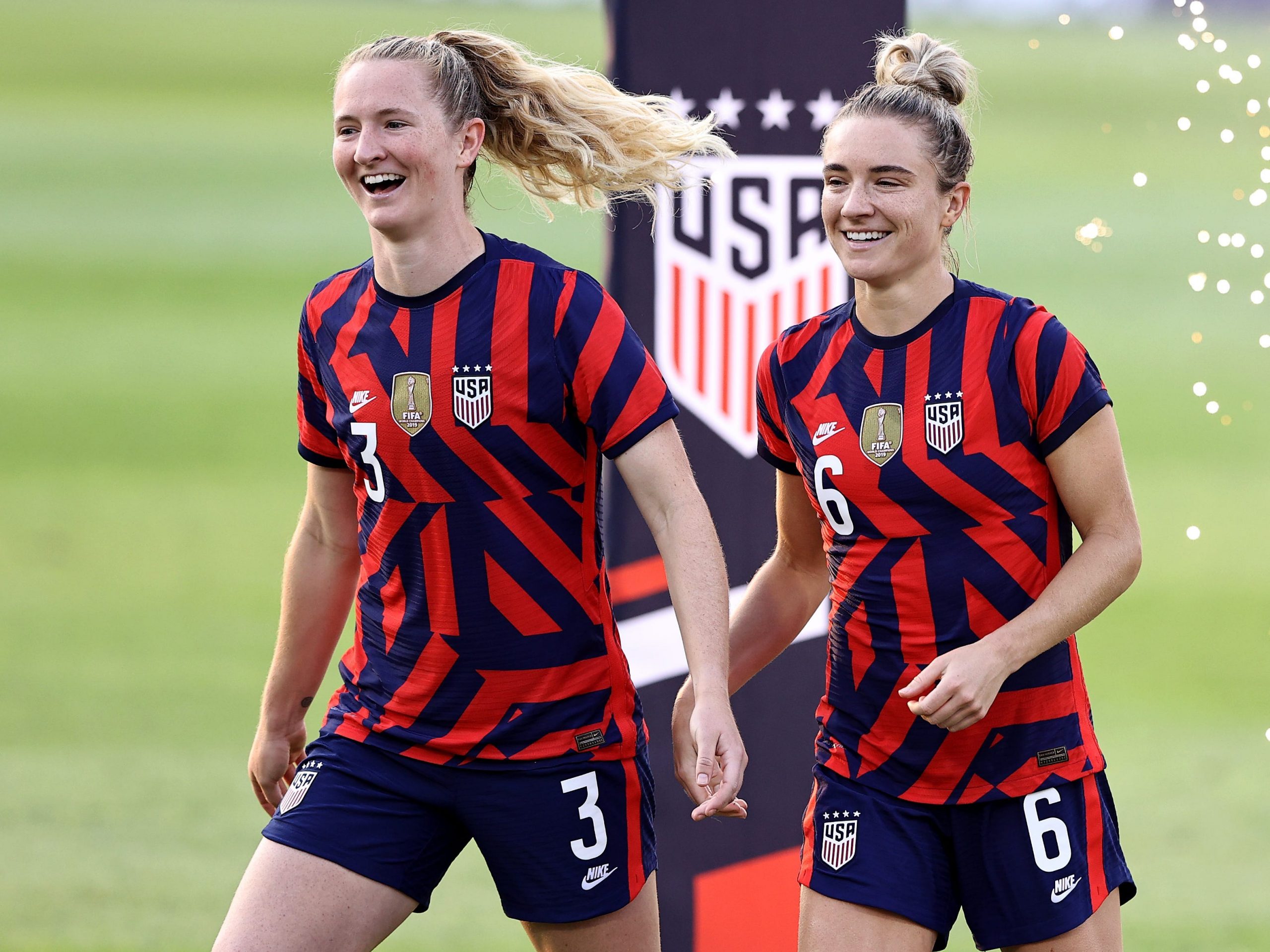 Samantha and Kristie Mewis on a soccer field