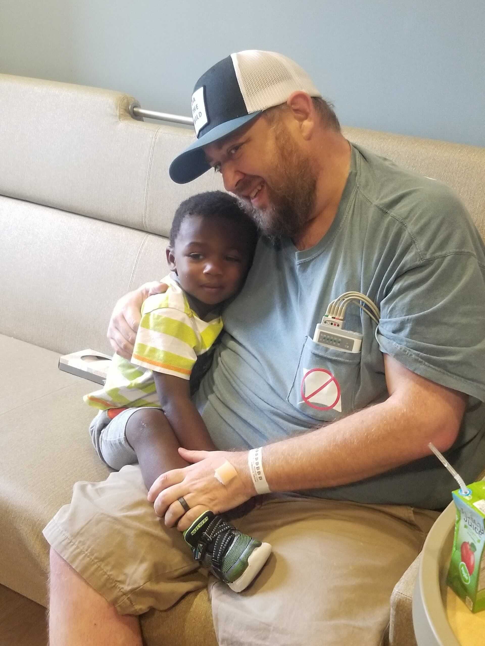 Matthew Moore sits with son Marshall