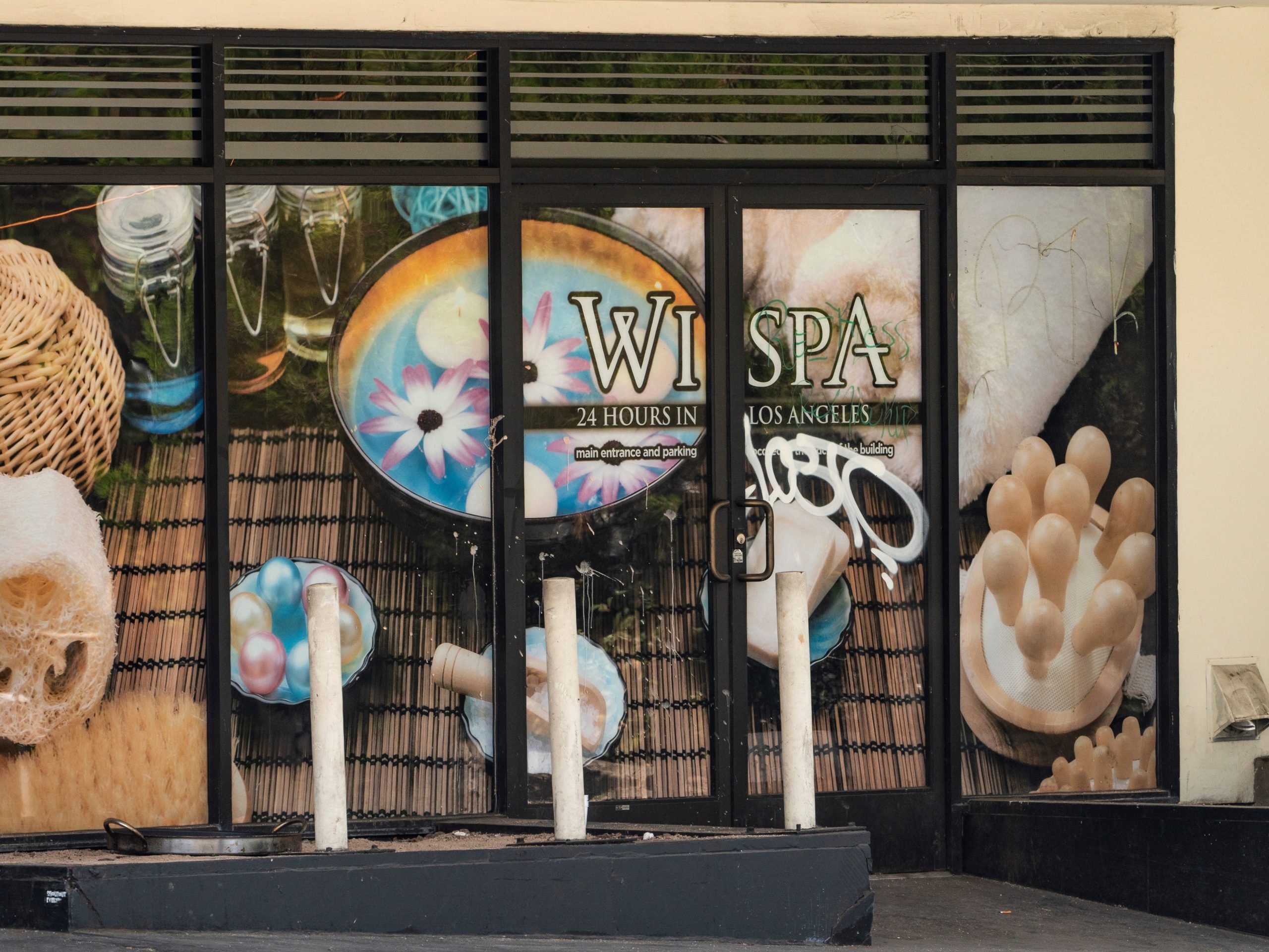 The exterior of a tagged window of the Wi Spa in Koreatown district in Los Angeles