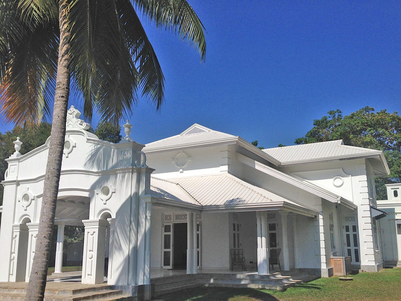 Exterior of the renovated Sri Lanka home shows an all-white finish