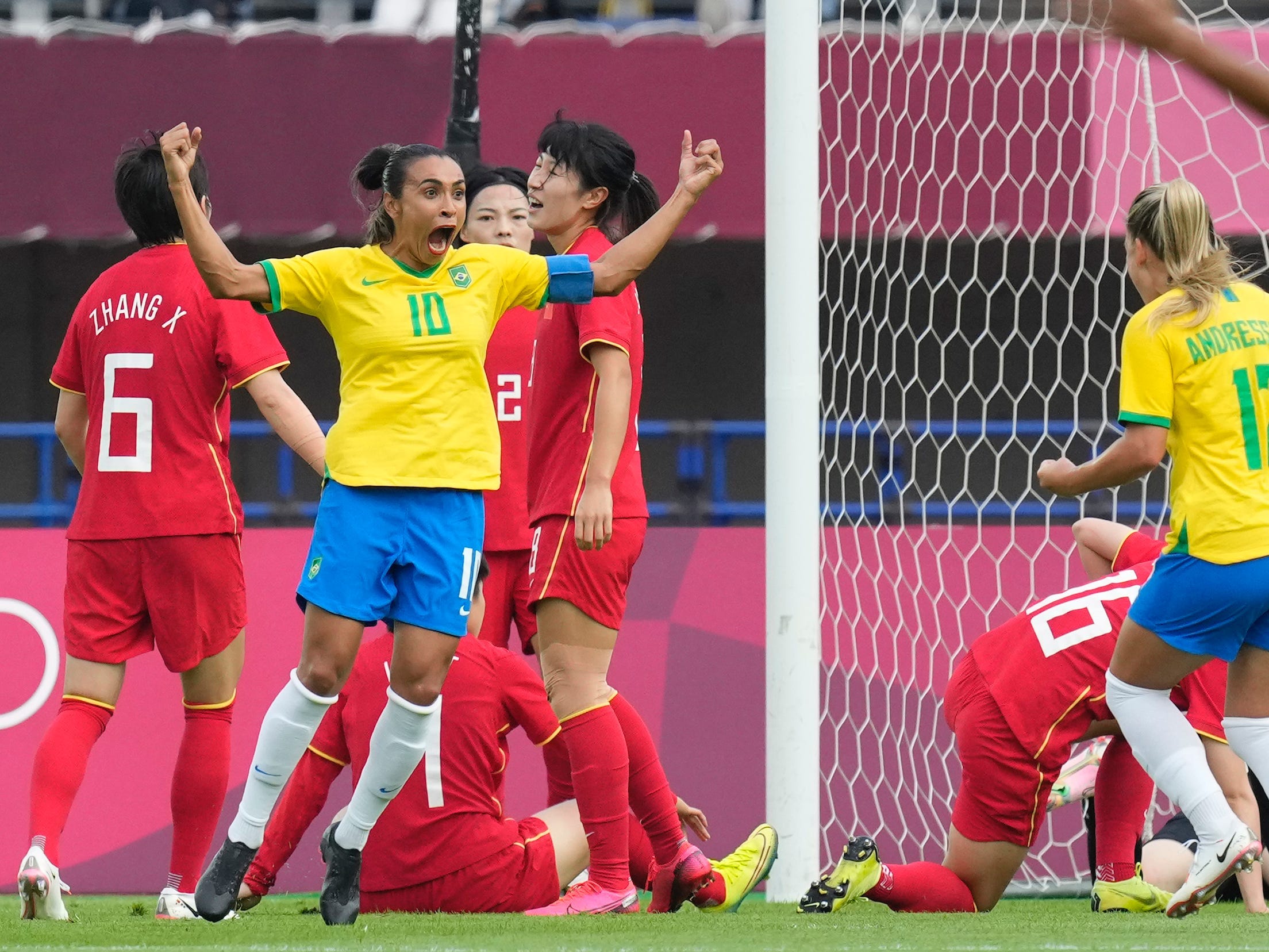 Marta celebrates a goal in Tokyo.