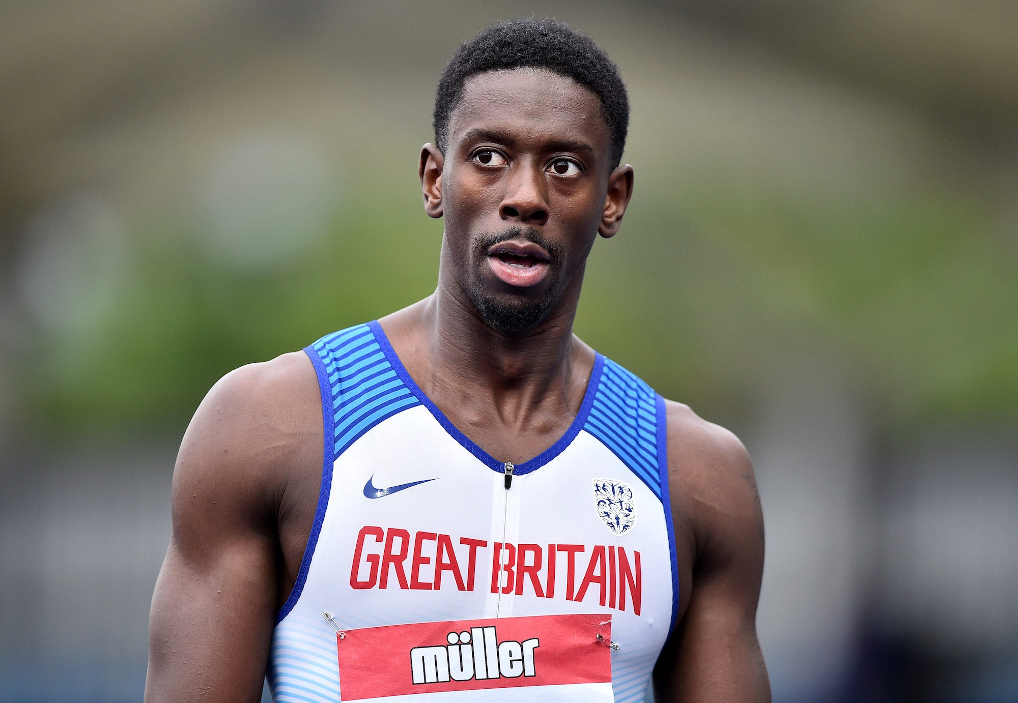 Reece Prescod of Enfield looks on after winning the Mens 100m Heat 3 on Day One of the Muller British Athletics Championships at Manchester Regional Arena