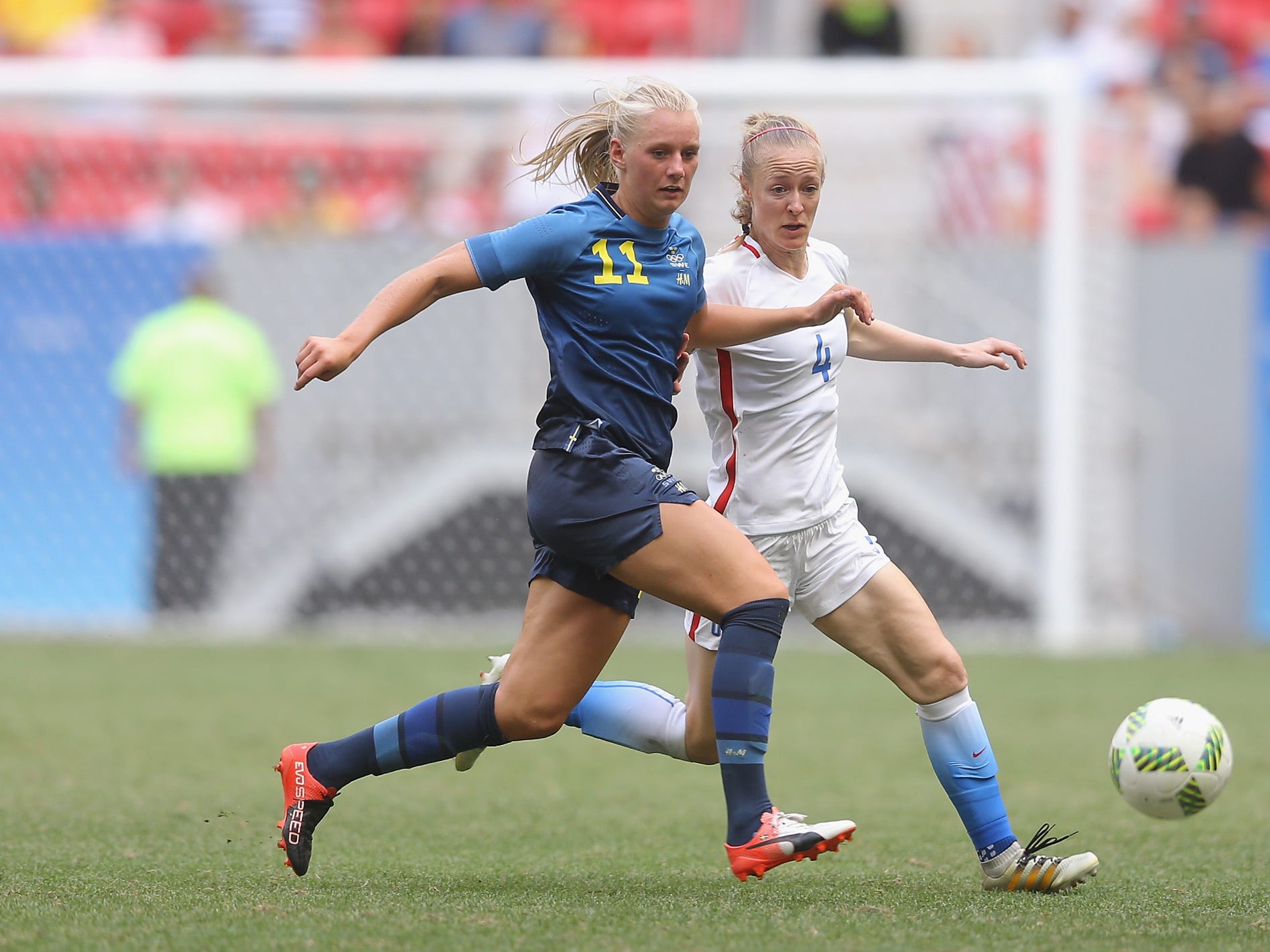 Stina Blackstenius dribbles past the USWNT's Becky Sauerbrunn.