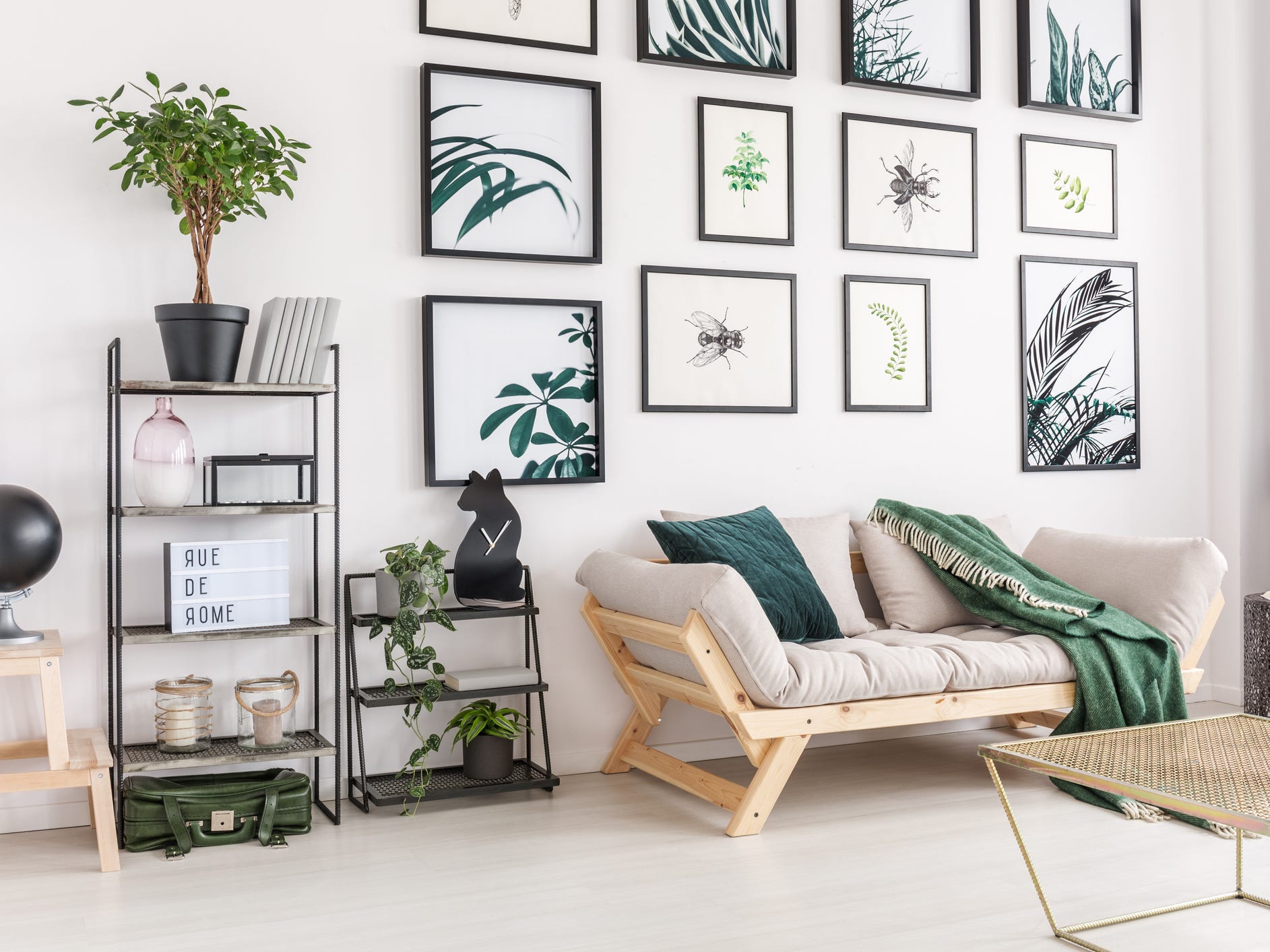 The interior of a living room with many pieces of art on the wall