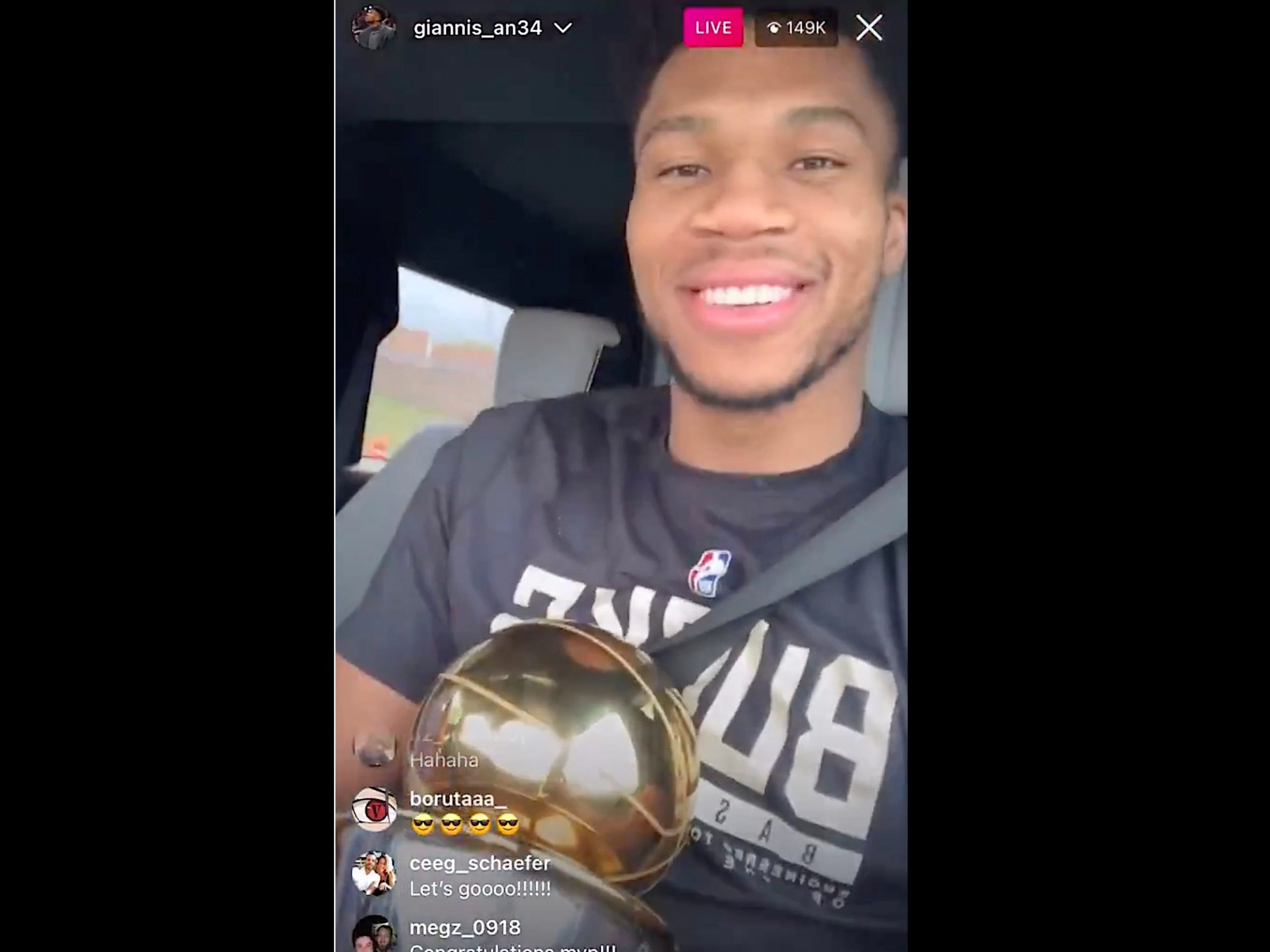 Giannis Antetokounmpo holds the NBA championship trophy