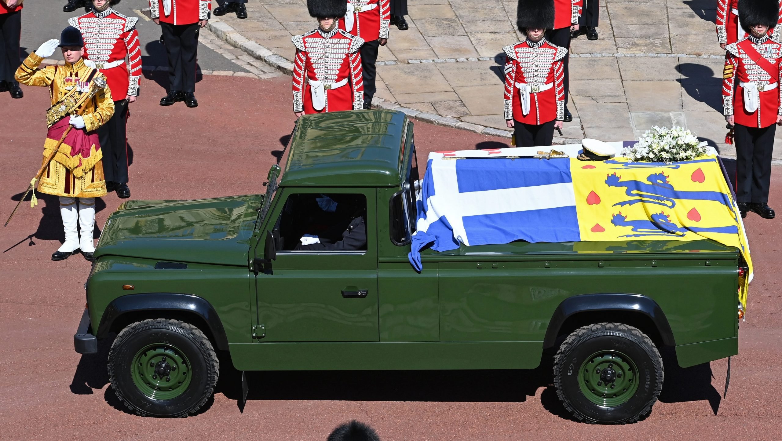 The coffin of Prince Philip, who died April 9, is seen arriving at his funeral at Windsor Castle in a specially designed Land Rover Defender hearse.