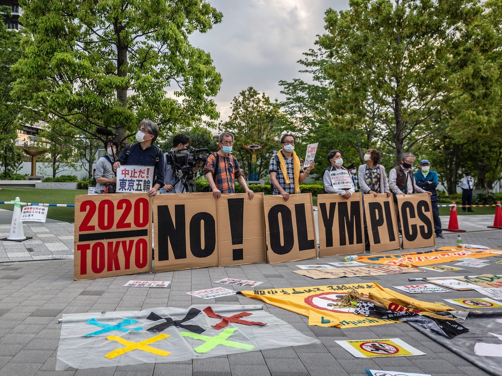 Protesters hold a 'No Olympics' banner during a protest against the Tokyo Olympics on May 9, 2021 in Tokyo.