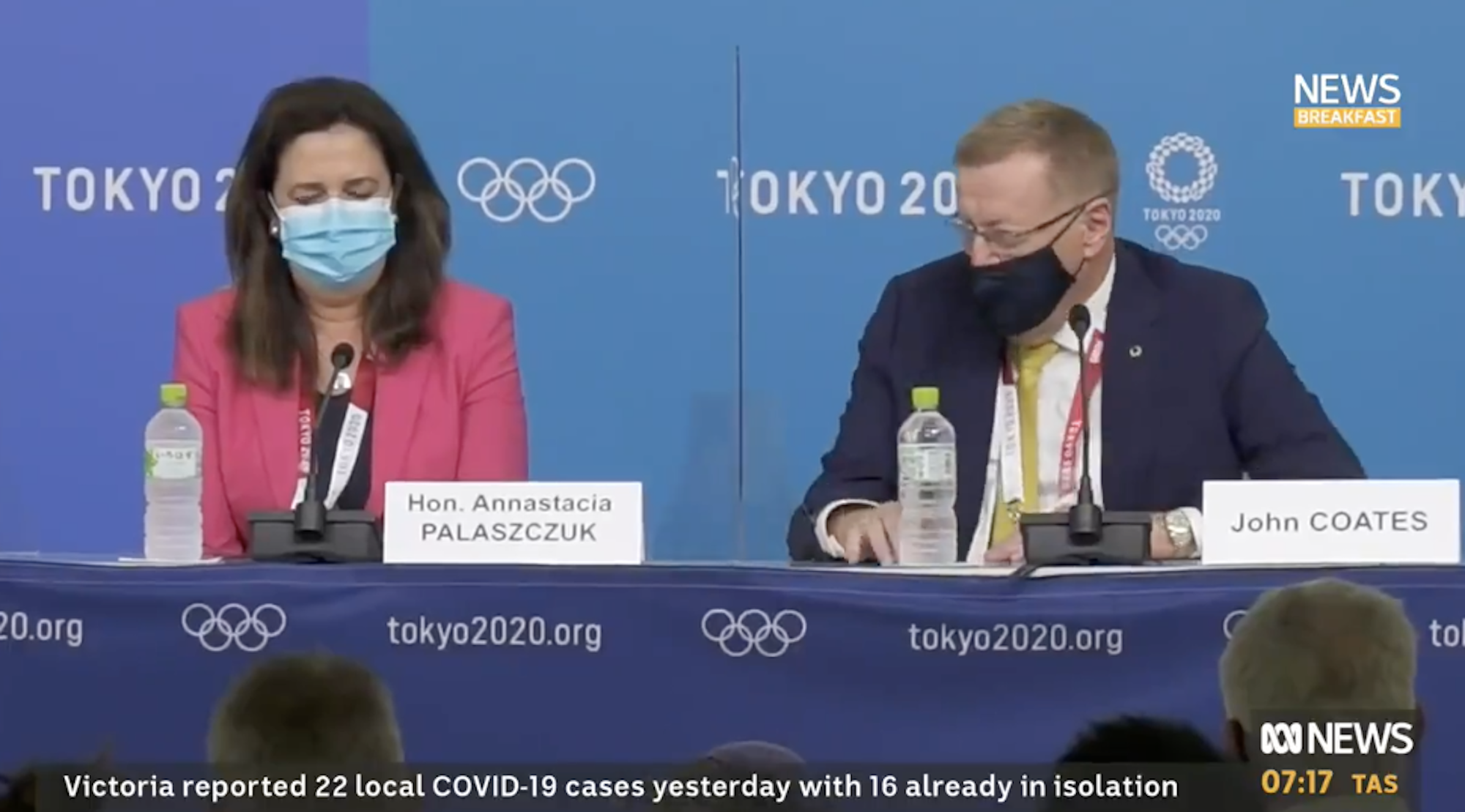 John Coates speaks to Queensland Premier Annastacia Palaszczuk during a press conference in Tokyo