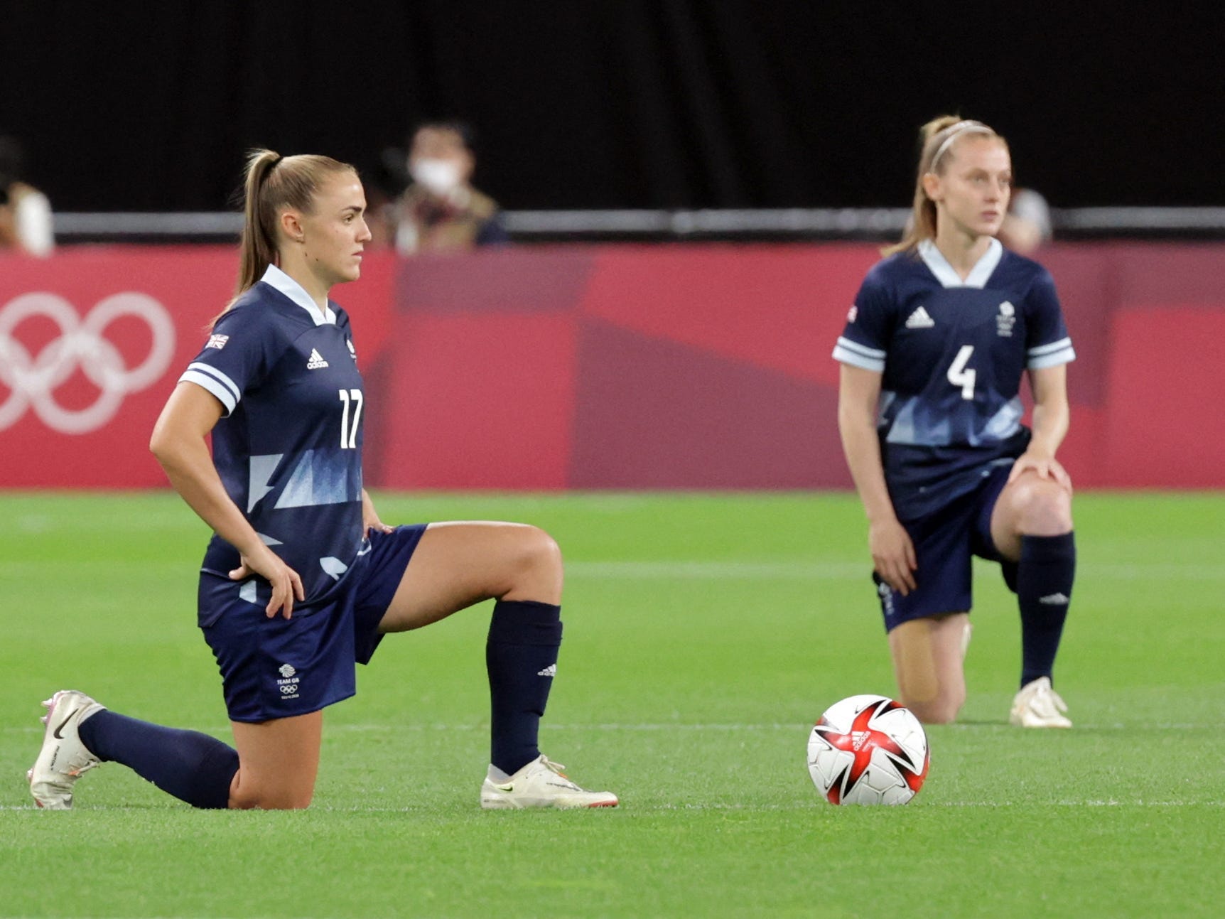 Team GB's Georgia Stanway and Keira Walsh take a knee before playing Chile at the Tokyo Olympics