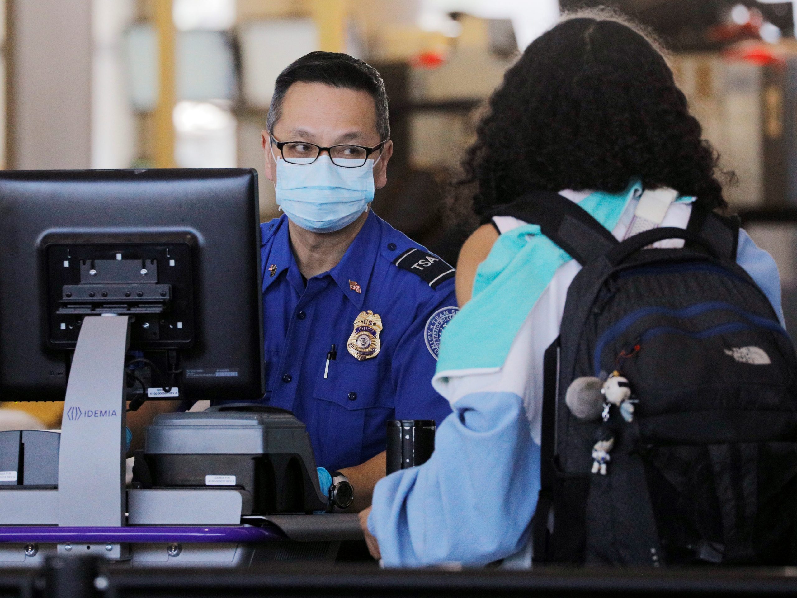 A TSA officer wears a mask at Logan International Airport in Boston in March 2020.