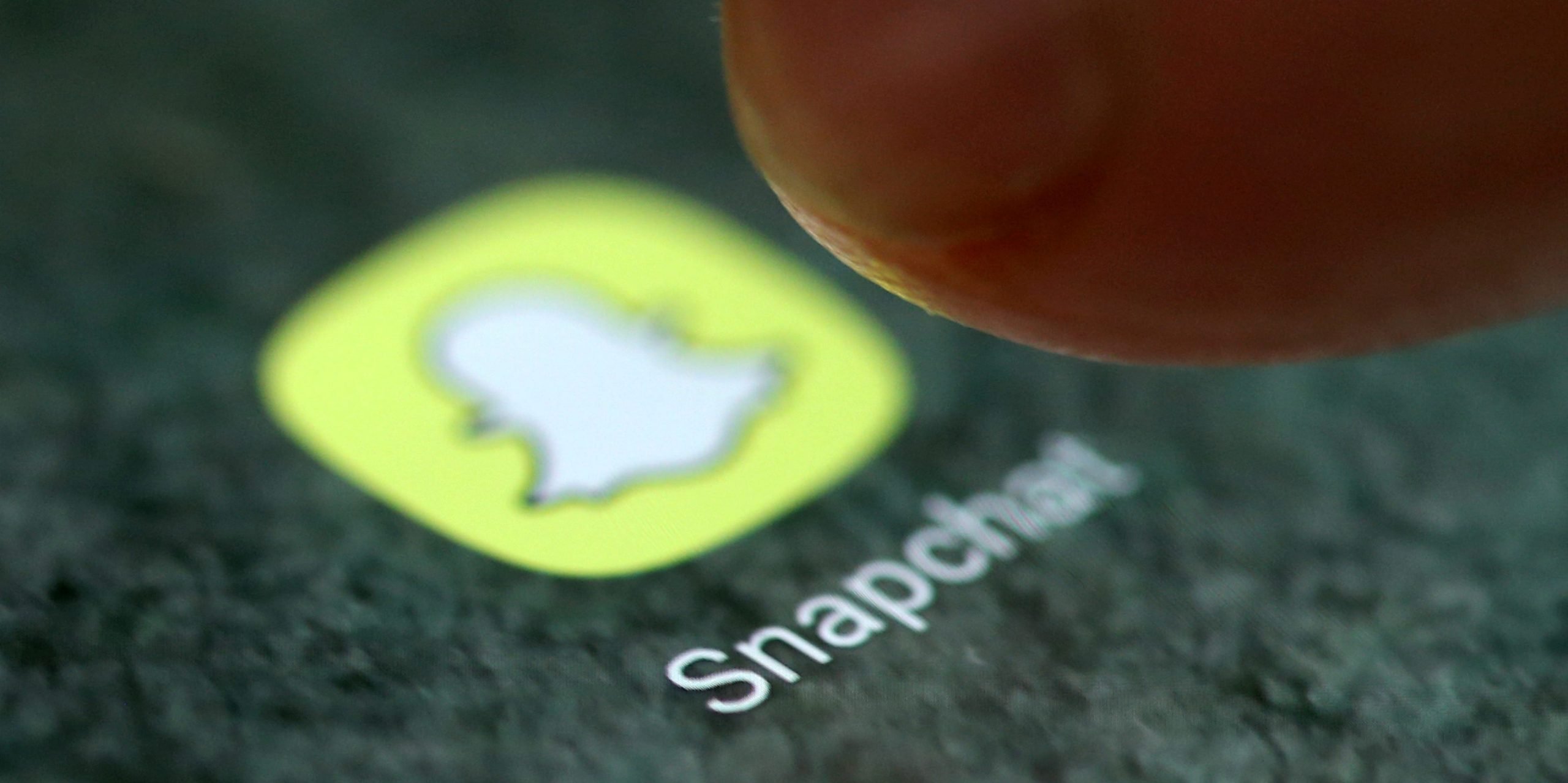 FILE PHOTO: The Snapchat app logo is seen on a smartphone in this picture illustration taken September 15, 2017. REUTERS/Dado Ruvic/Illustration/File Photo