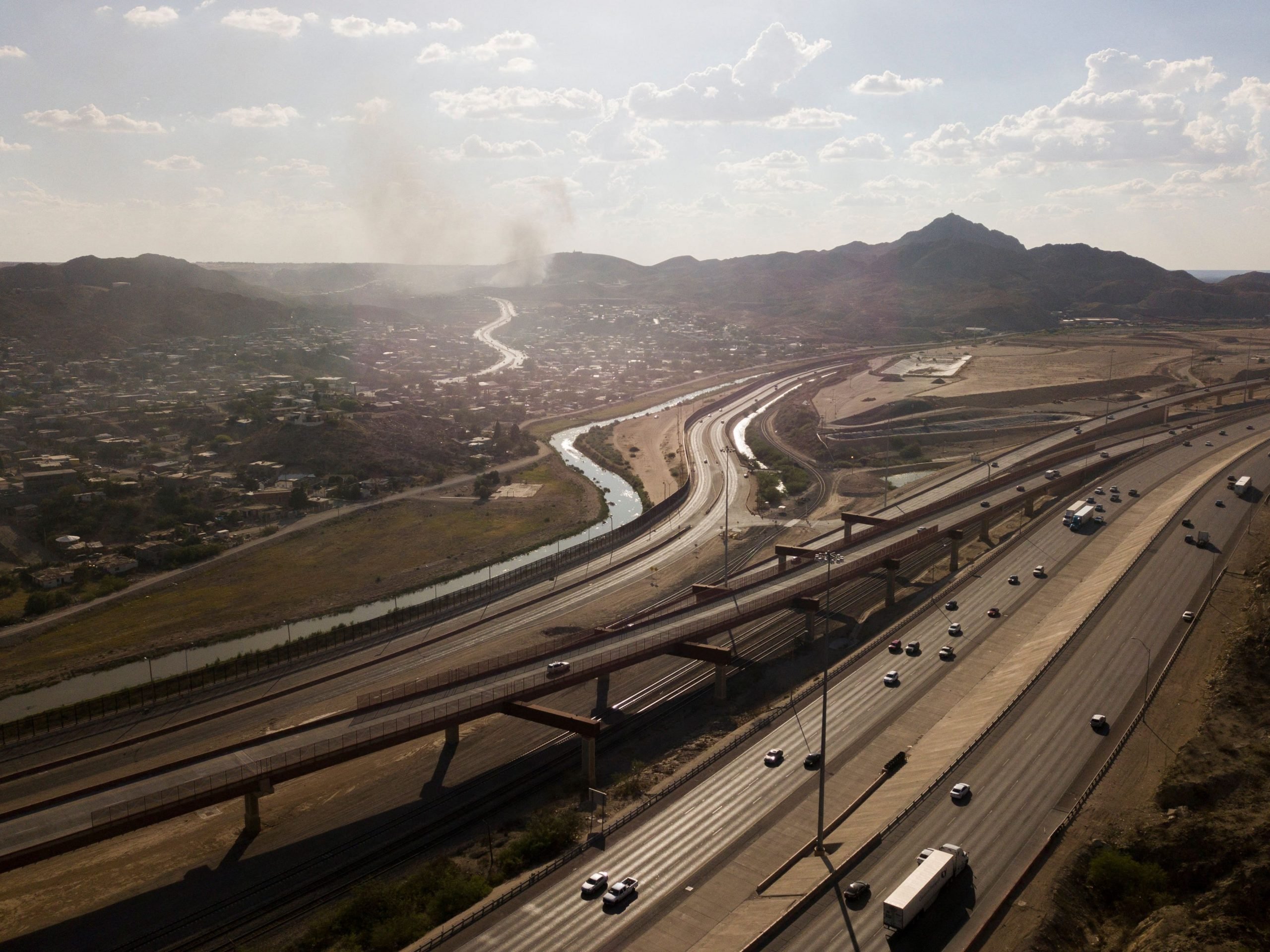 An aerial picture taken on June 24, 2021 shows the Rio Grande river and border wall fencing at the US-Mexico border separating El Paso and the Mexican city of Ciudad Juarez, Chihuahua state, Mexico, in El Paso, Texas.