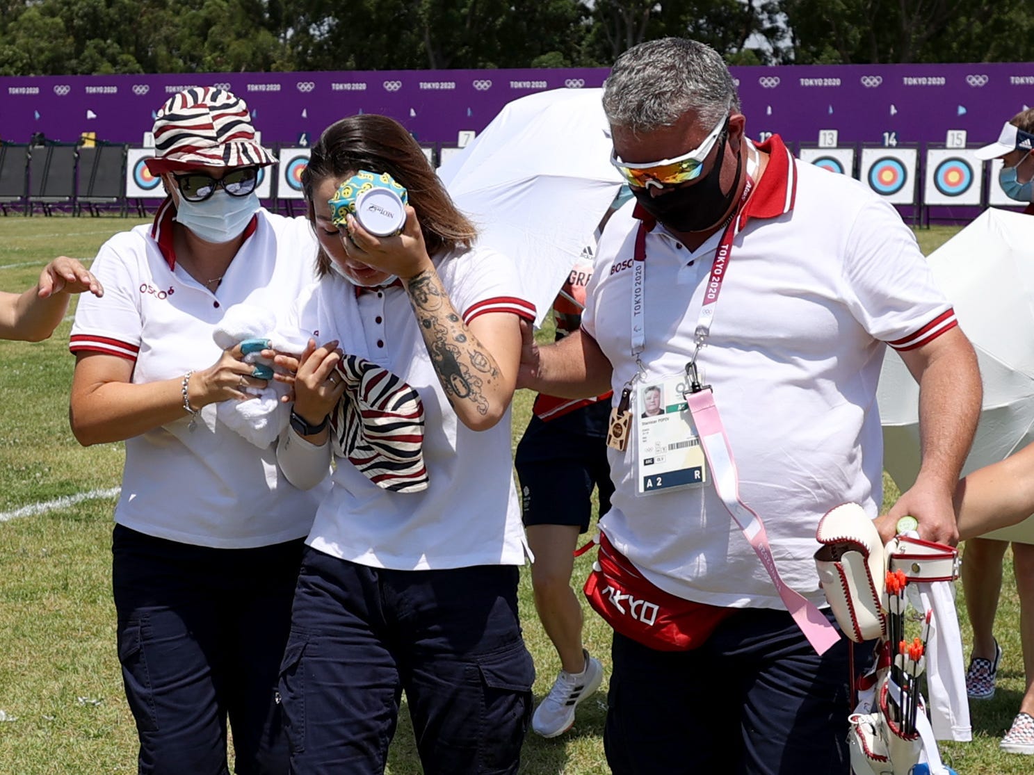 Svetlana Gomboeva of Team ROC is treated for heat exhaustion in the Women's Individual Ranking Round during the Tokyo 2020 Olympic Games