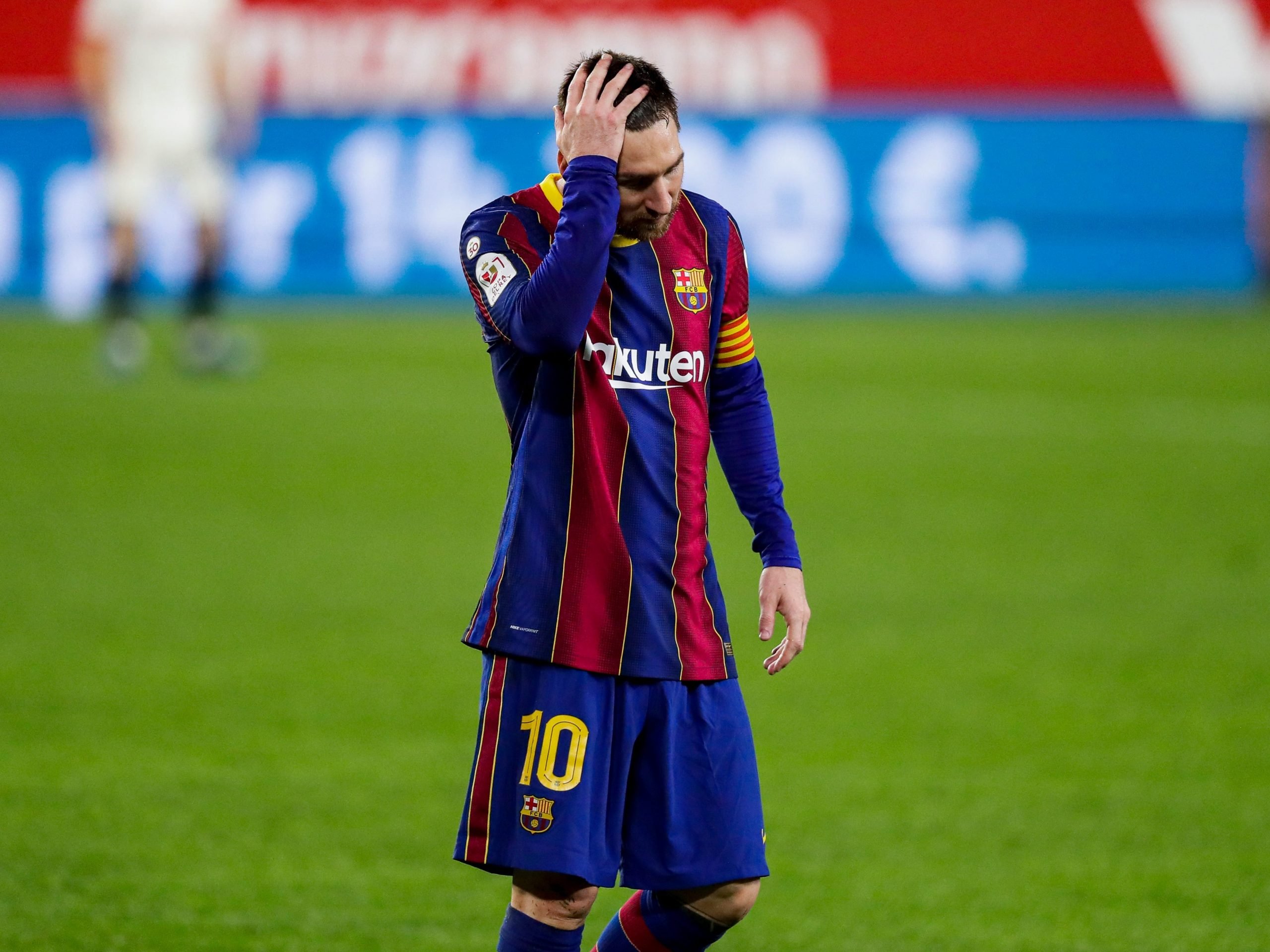 Lionel Messi puts his head in his hand during a Barcelona match