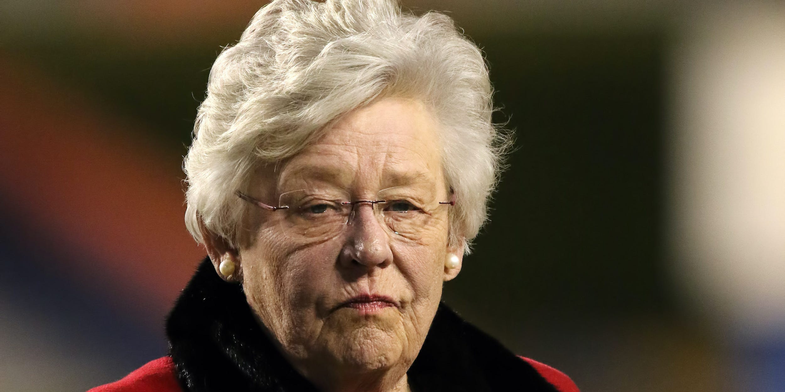 Alabama Governor Kay Ivey is presented with an award at the Alabama 7A State Championship game