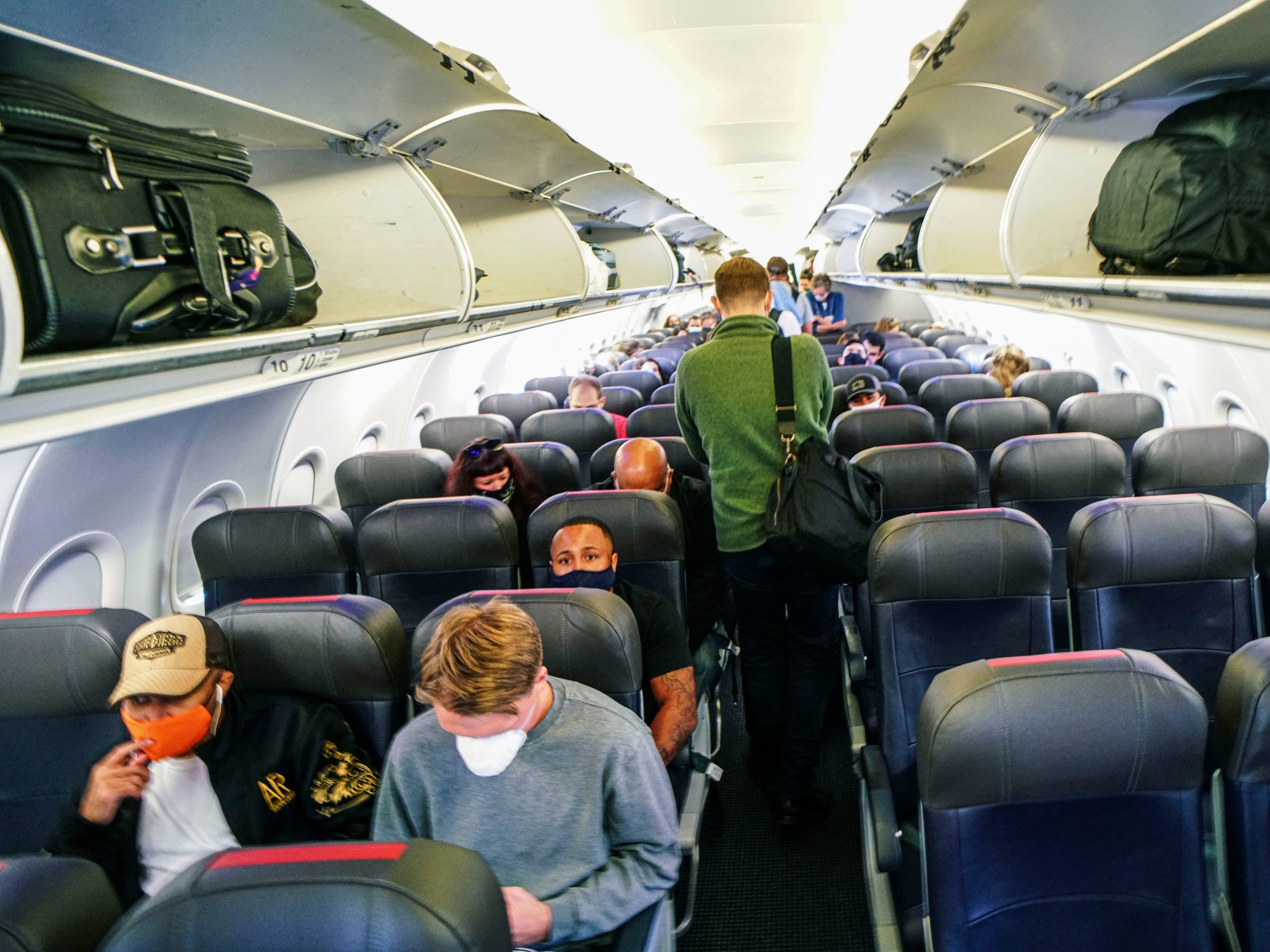 Passengers sit in an American Airlines airplane before flying from California to North Carolina