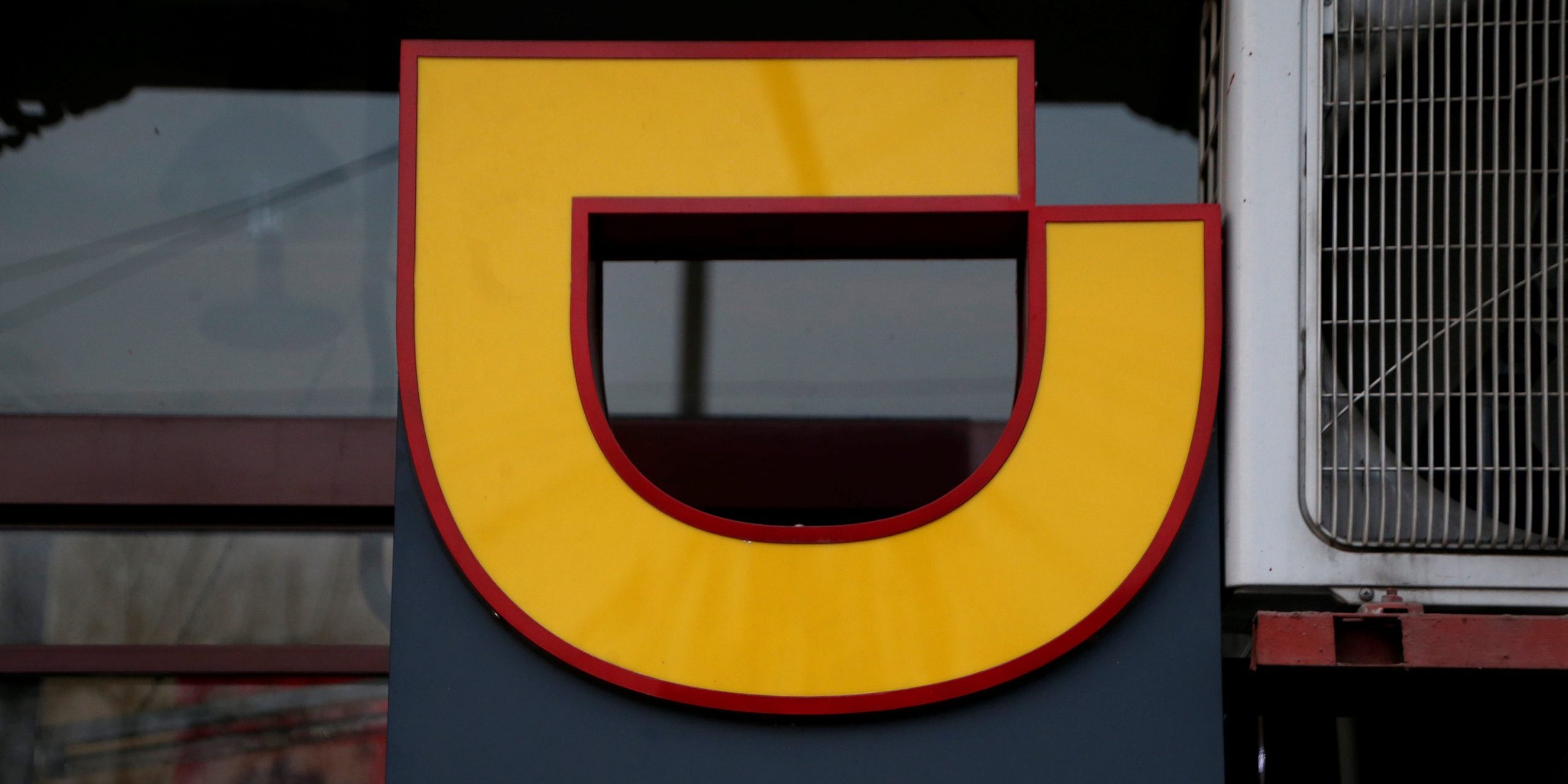 FILE PHOTO: The logo of Didi Chuxing is seen at a Didi station in Beijing, China January 2, 2019. REUTERS/Jason Lee