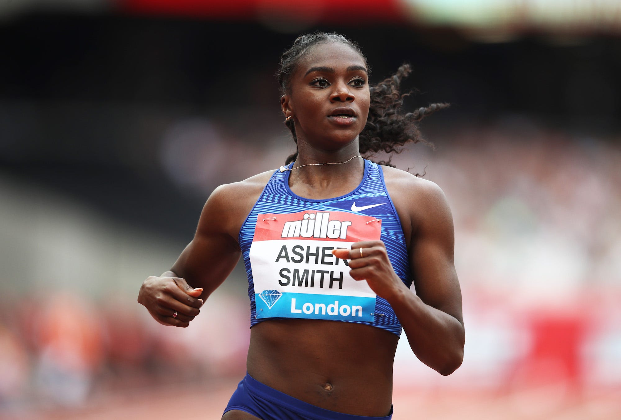 Dina Asher-Smith of Great Britain crosses the line to win her Women's 100m Heat during Day Two of the Muller Anniversary Games IAAF Diamond League event at the London Stadium