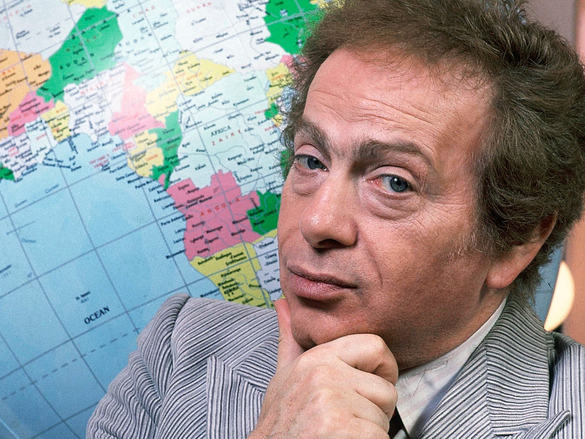 In this Jan. 27, 1987, file photo, Jackie Mason poses in his dressing with a globe as he stars in his own Broadway show in New York.