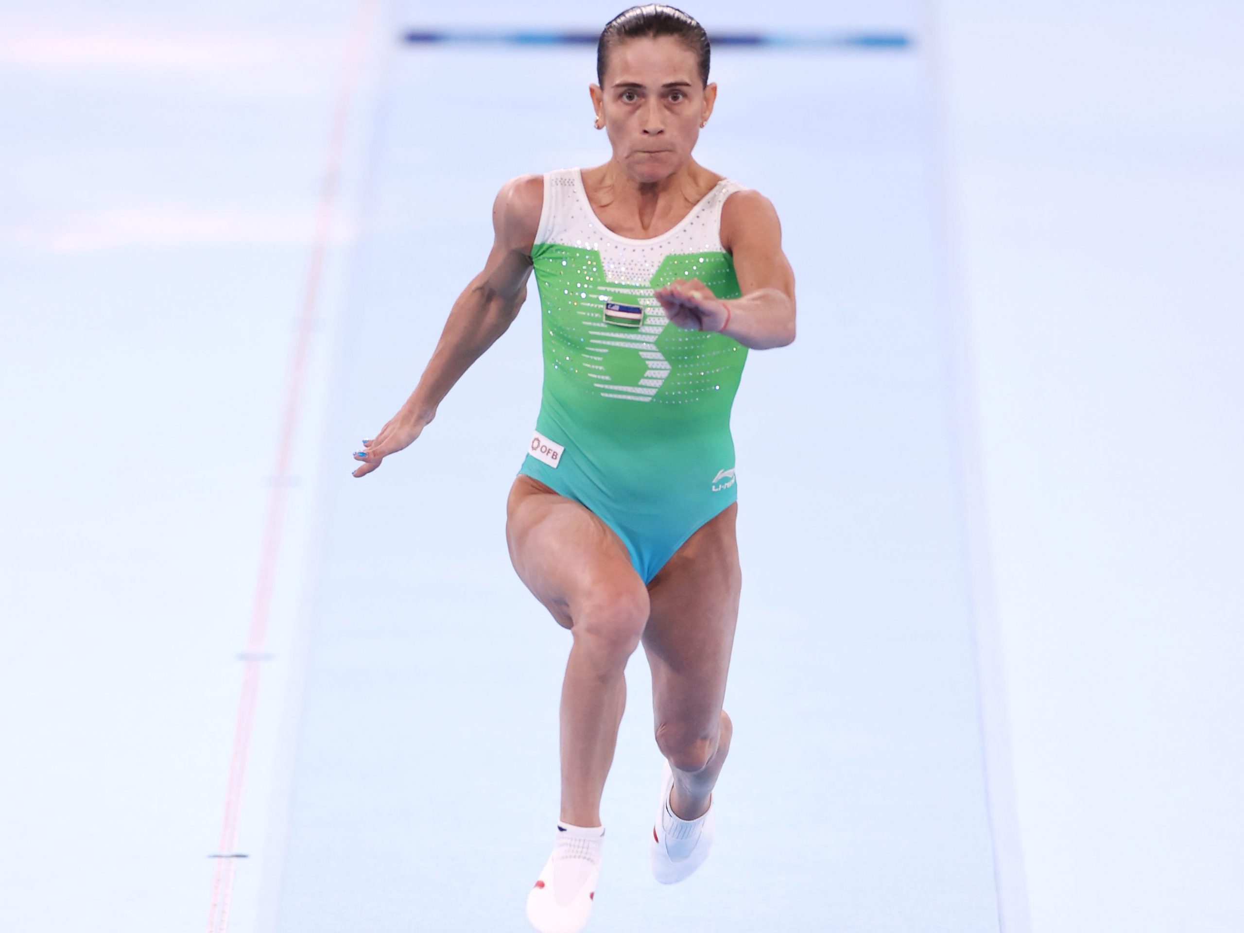 Oksana Chusovitina competing on vault during the Tokyo Olympics.
