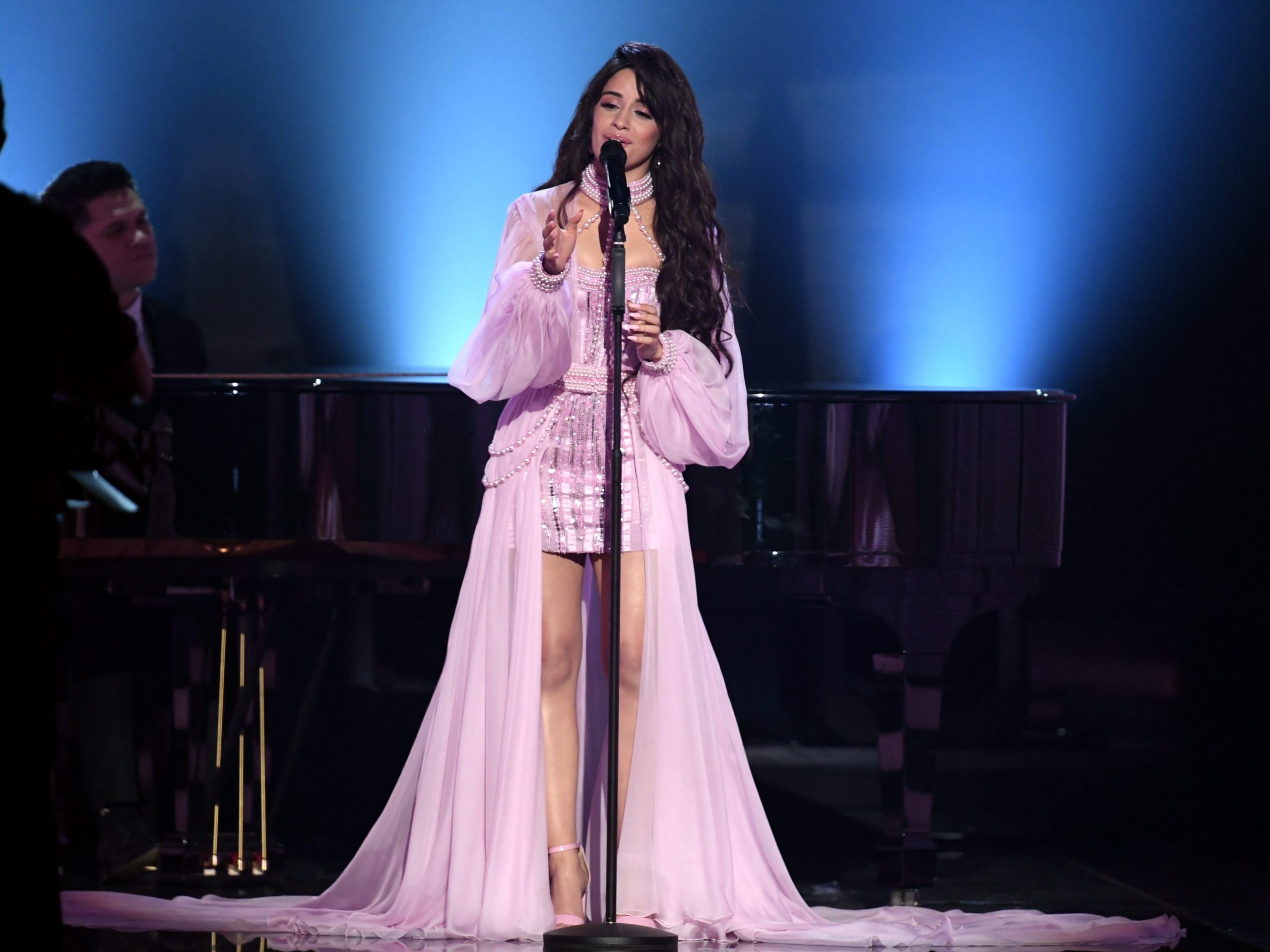 Camila Cabello wears a pink dress while performing at the Grammys.