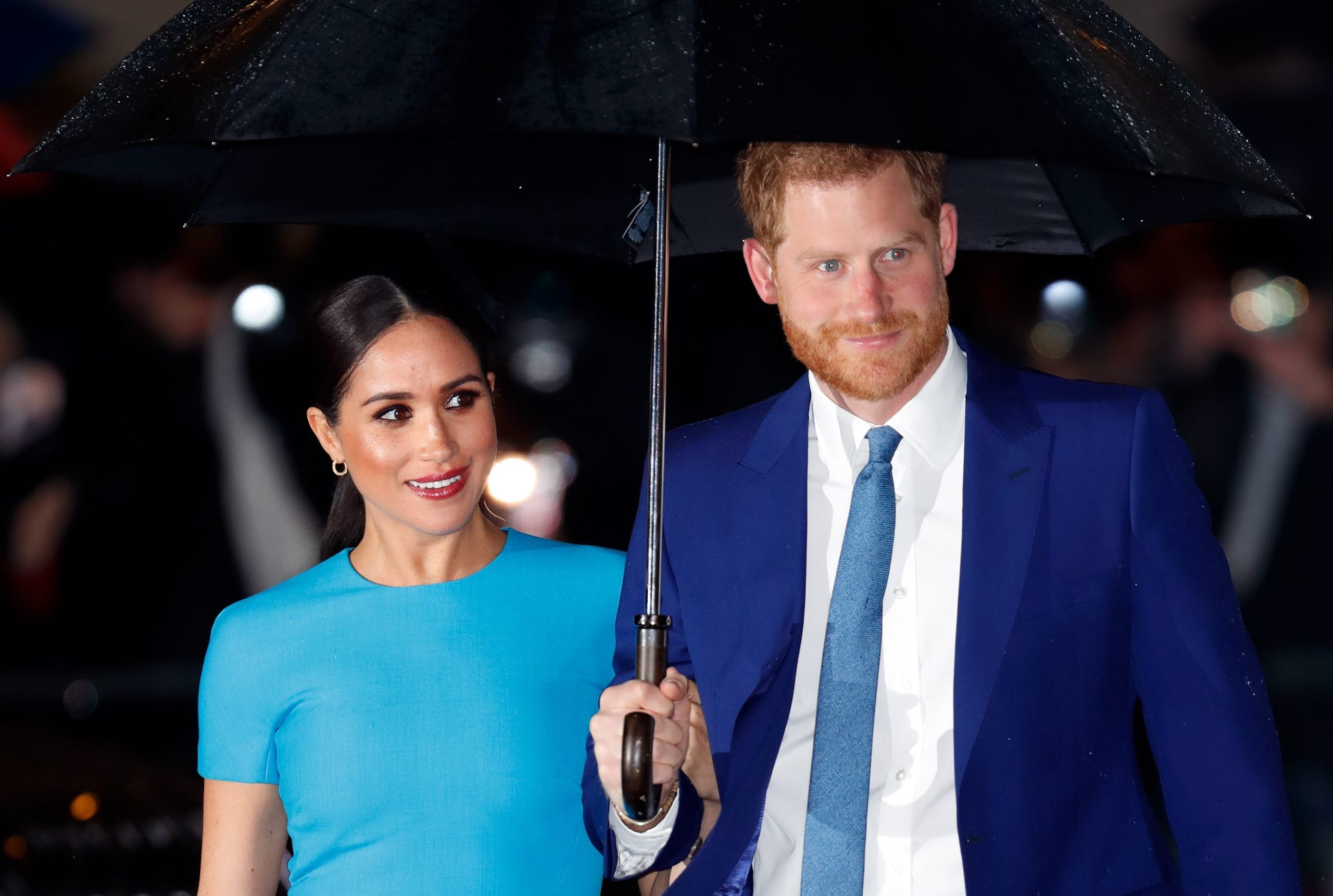 Prince Harry and Meghan Markle pictured under an umbrella attending The Endeavour Fund Awards at Mansion House on March 5, 2020