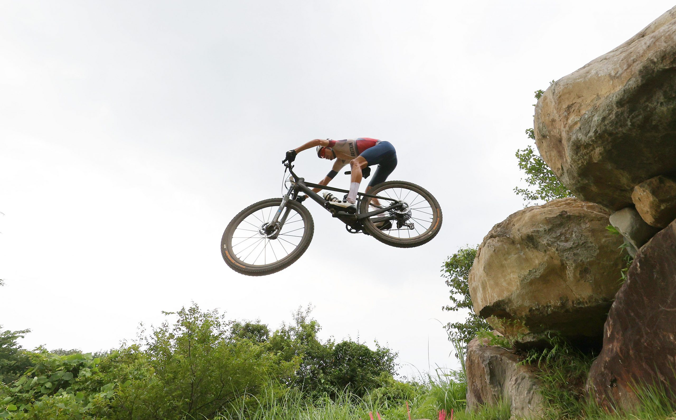 Tom Pidcock races en route to a gold medal in the men's cross country mountain bike race.