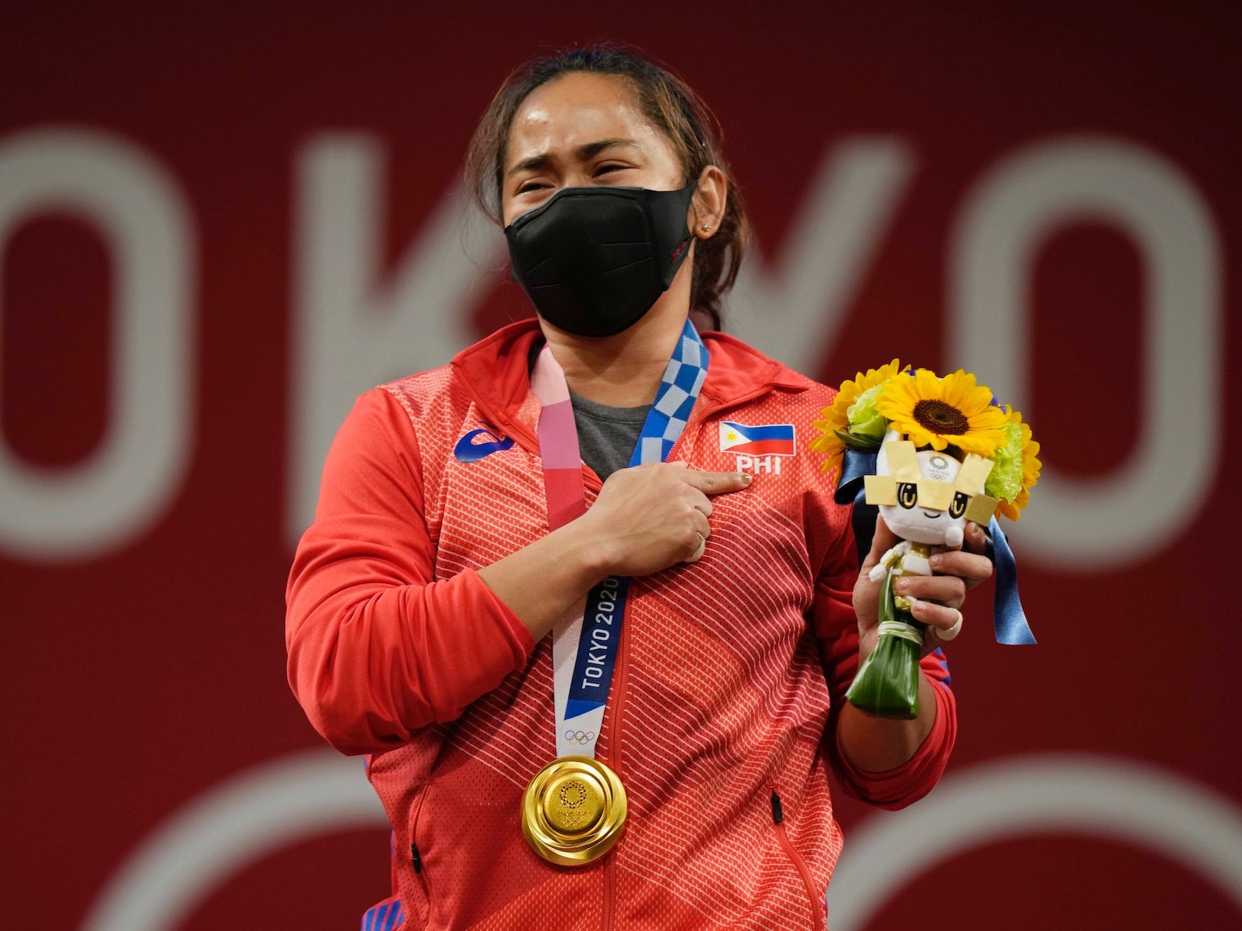 Hidilyn Diaz celebrates during the Tokyo Olympics.