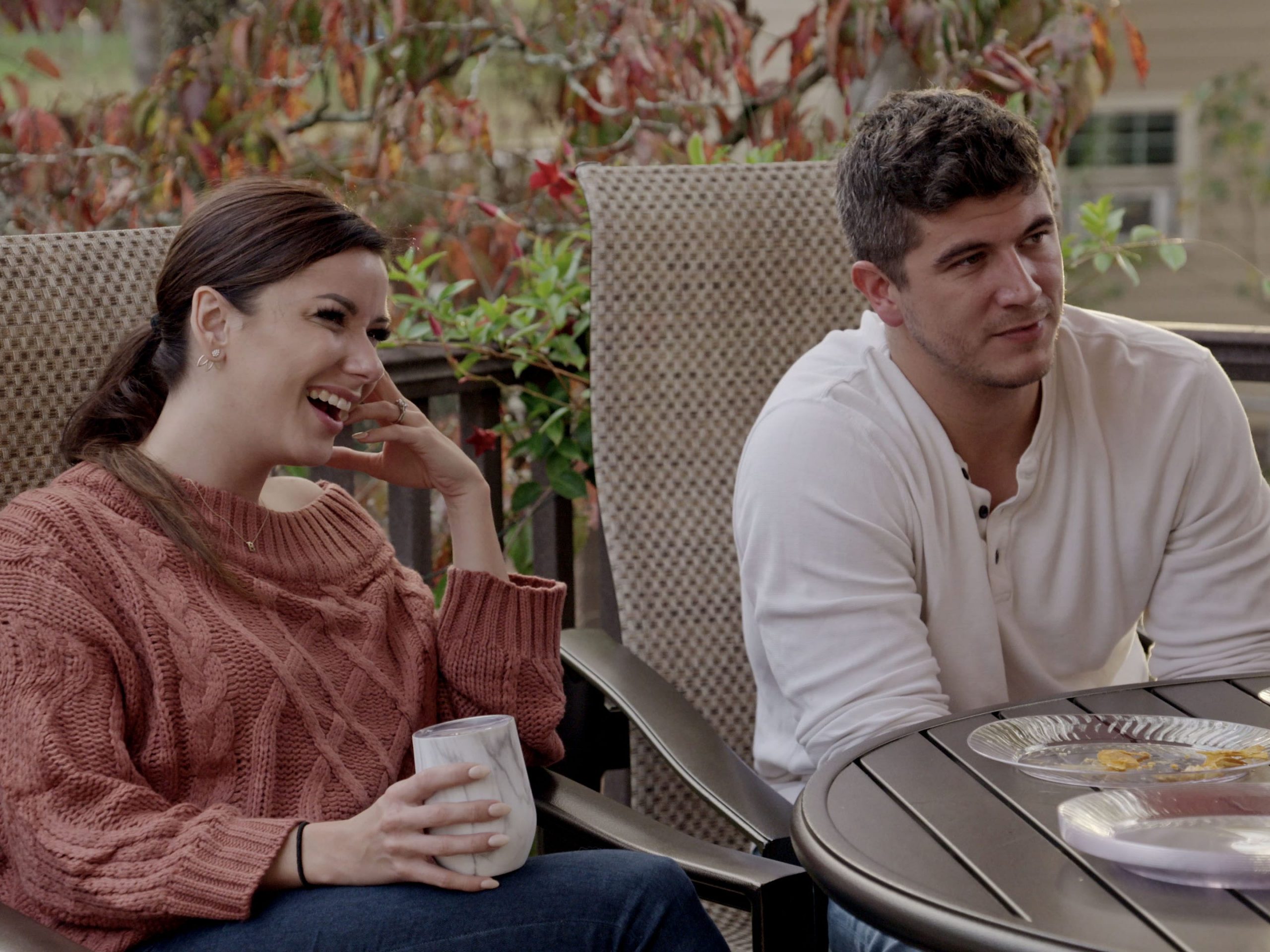 amber pike and matt barnett sitting on patio