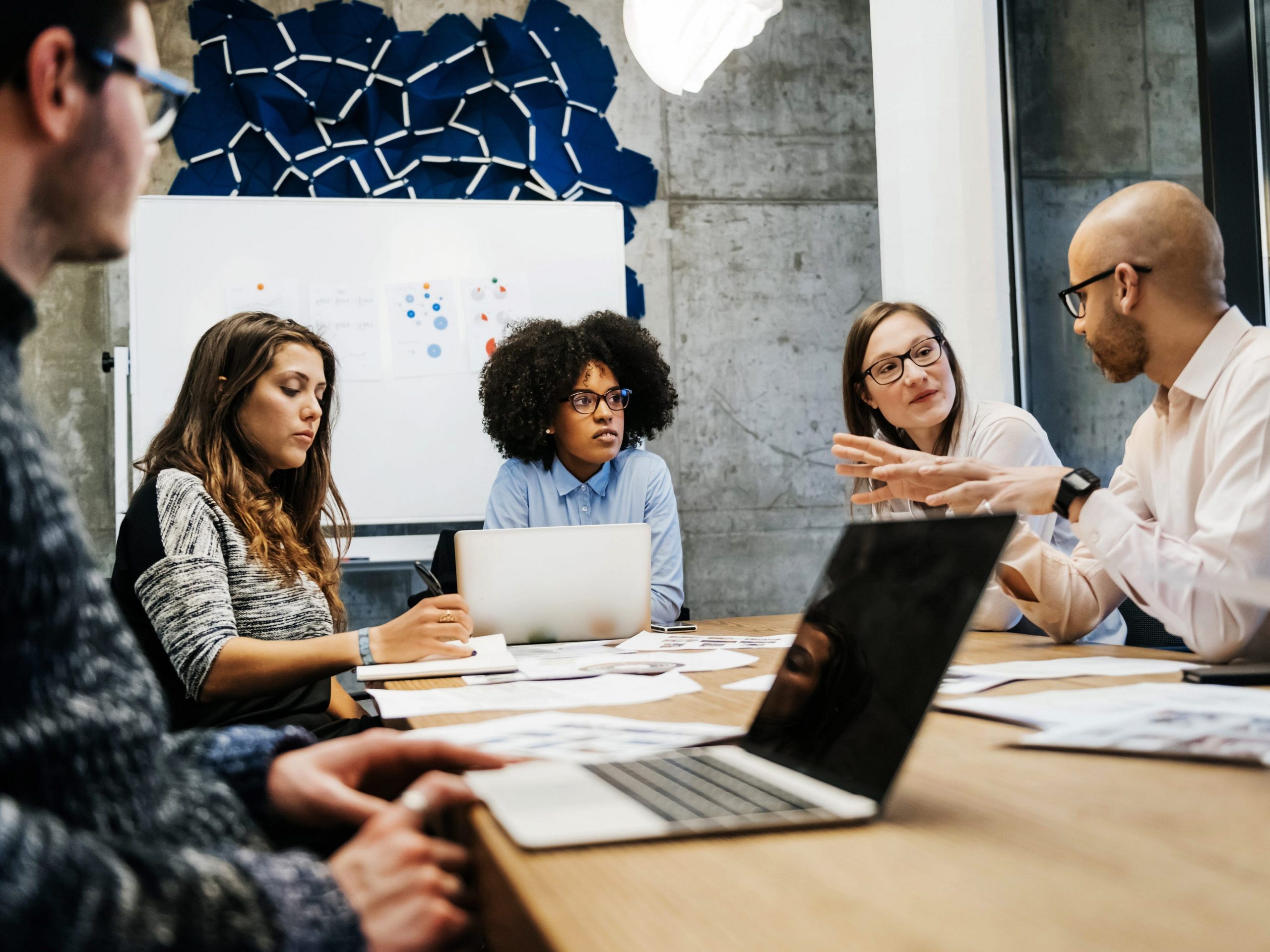 people sitting in an office at a meeting