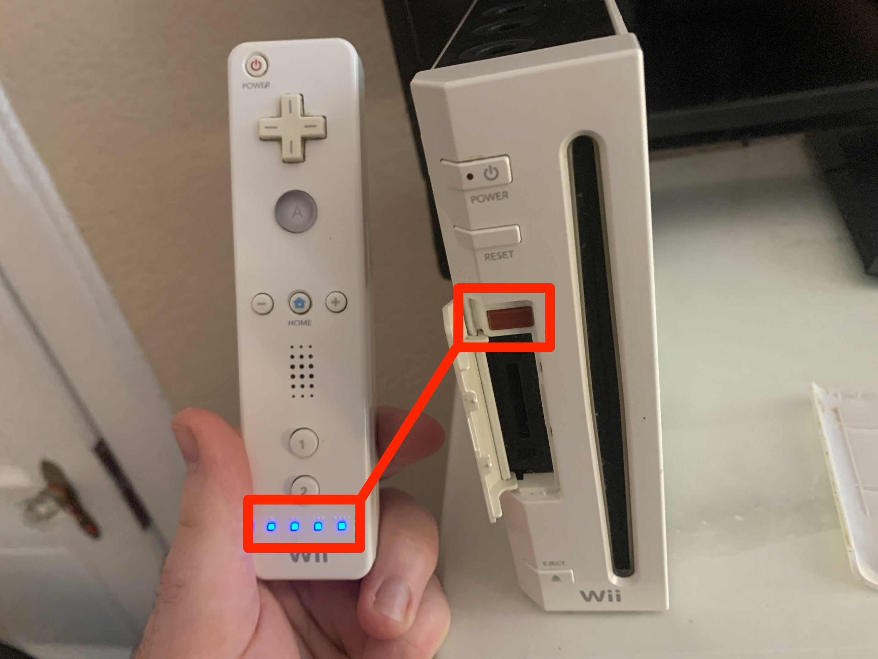 how to reset wii remote player 1