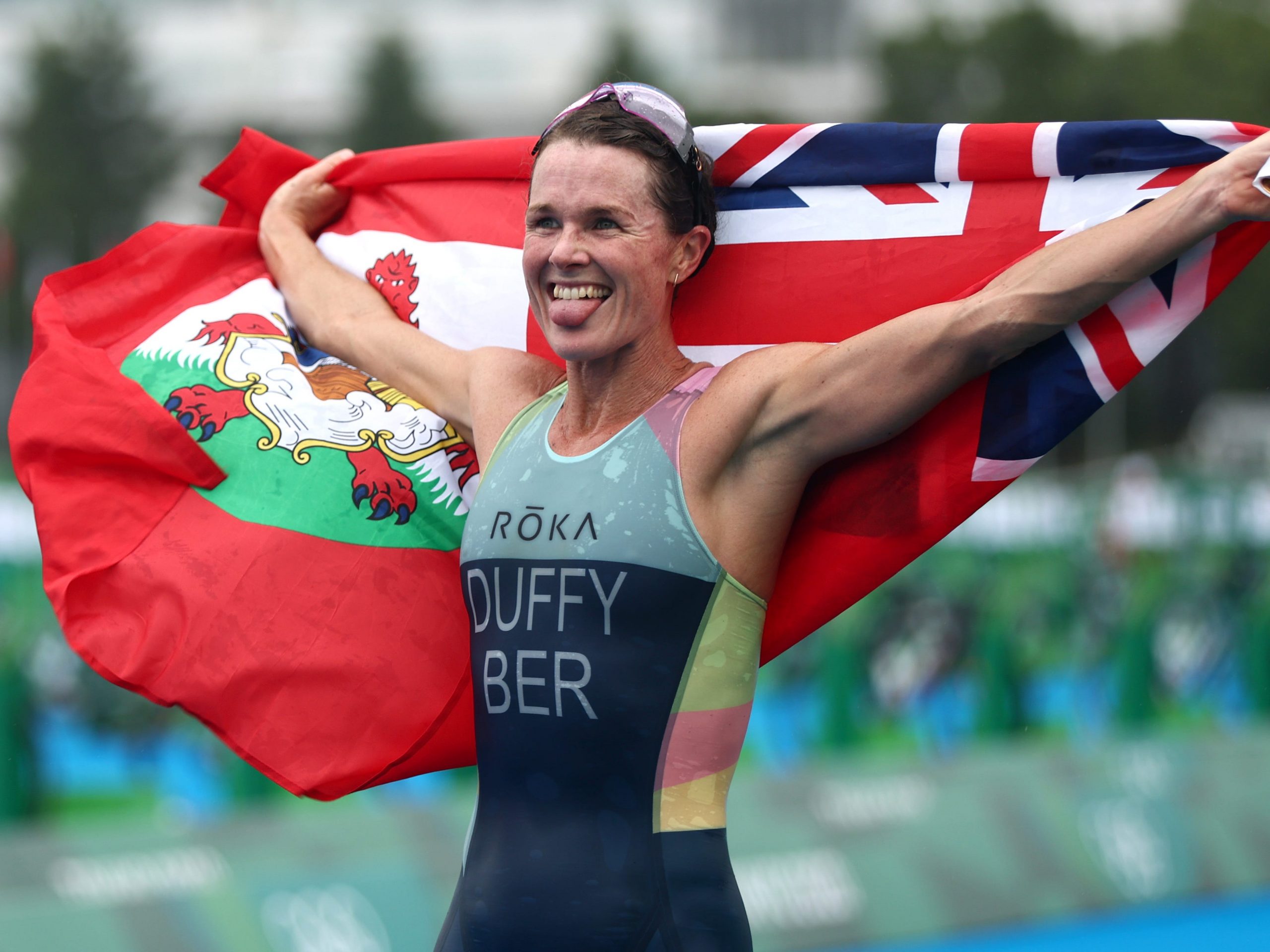 Flora Duffy of Team Bermuda celebrates winning the gold medal during the Women's Individual Triathlon at the Tokyo Olympics