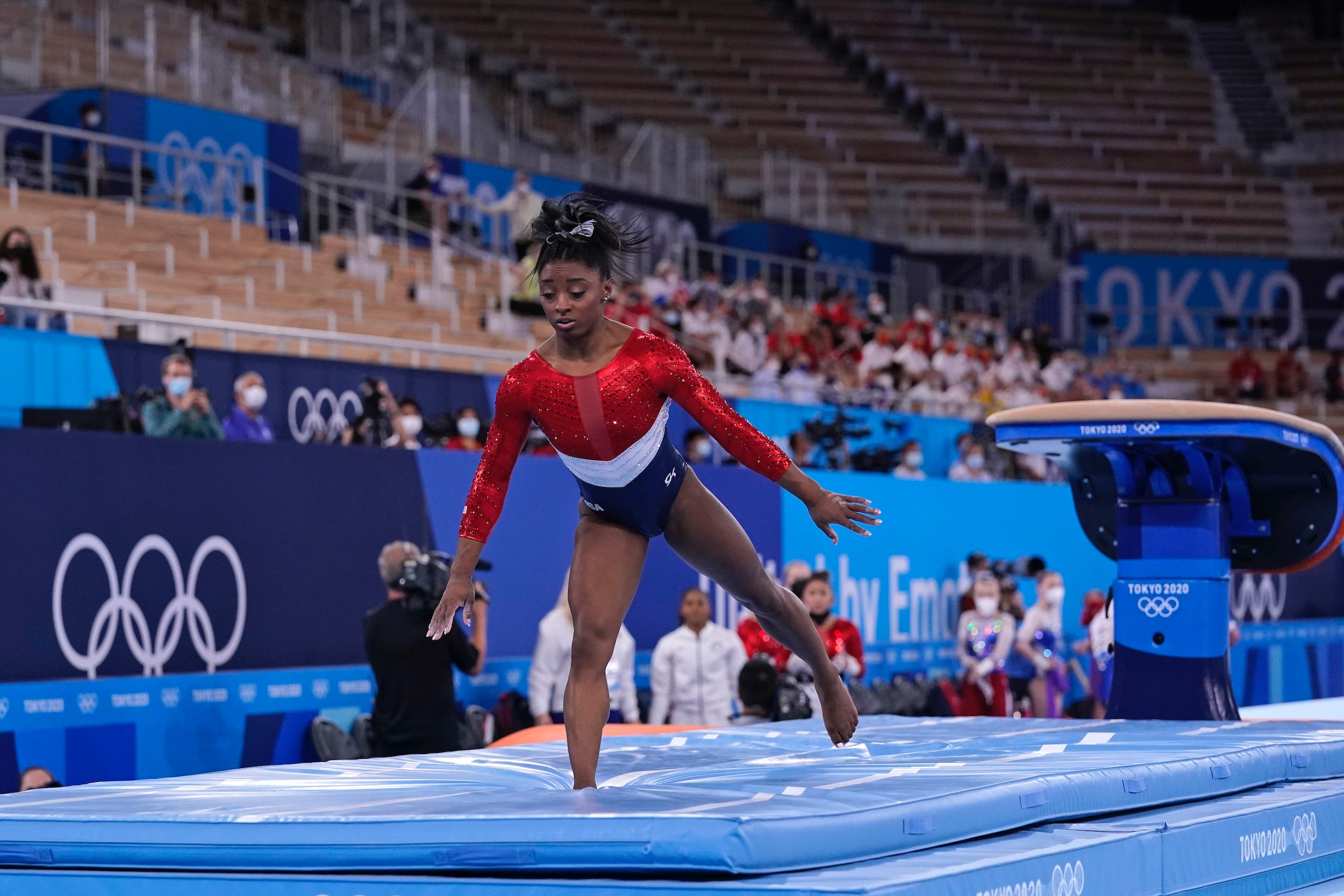 Simone Biles lands after her vault routine.