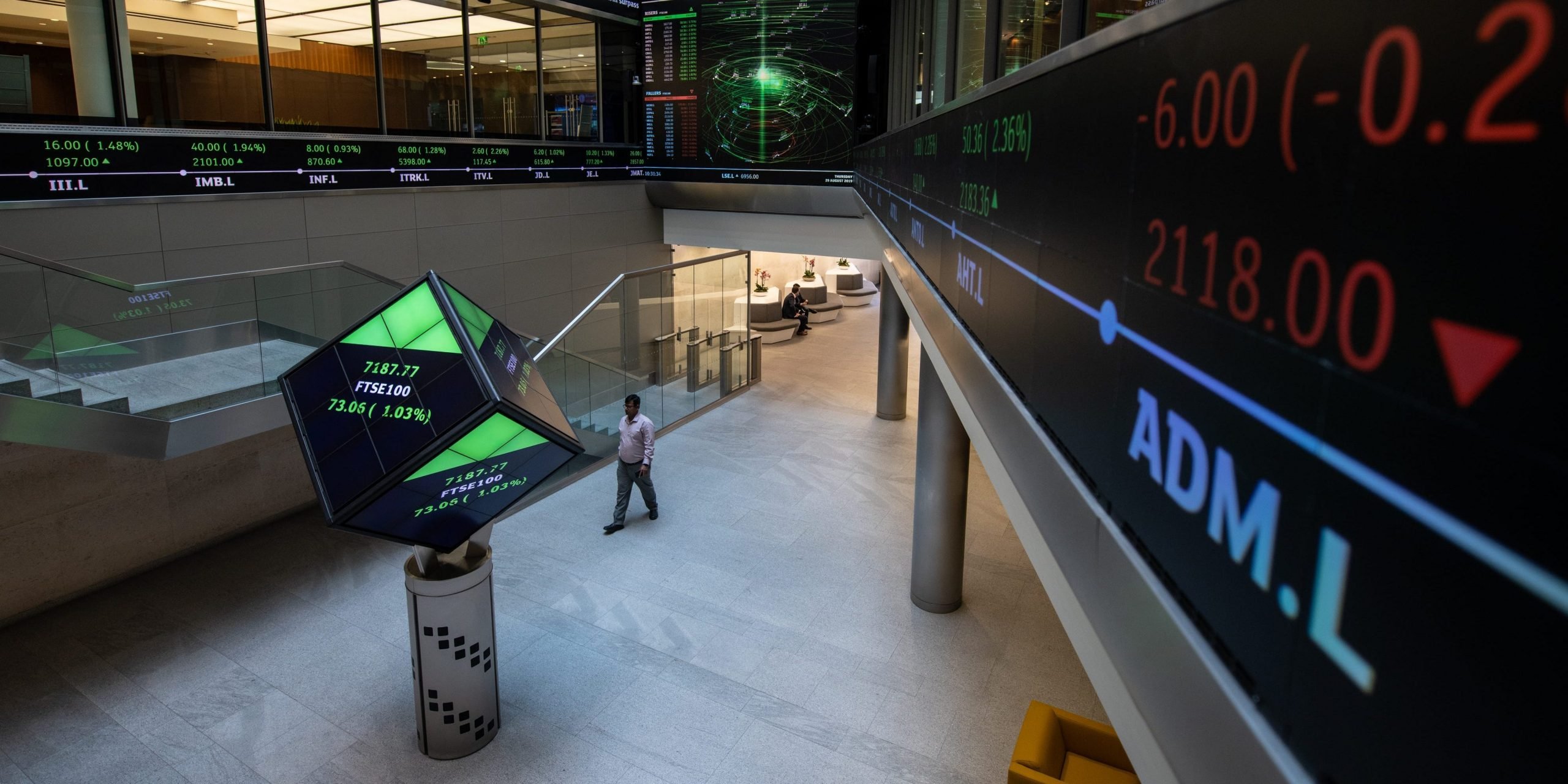 Financial market figures are shown on big screens and a ticker in the main entrance at London Stock Exchange on August 29, 2019 in London, England.