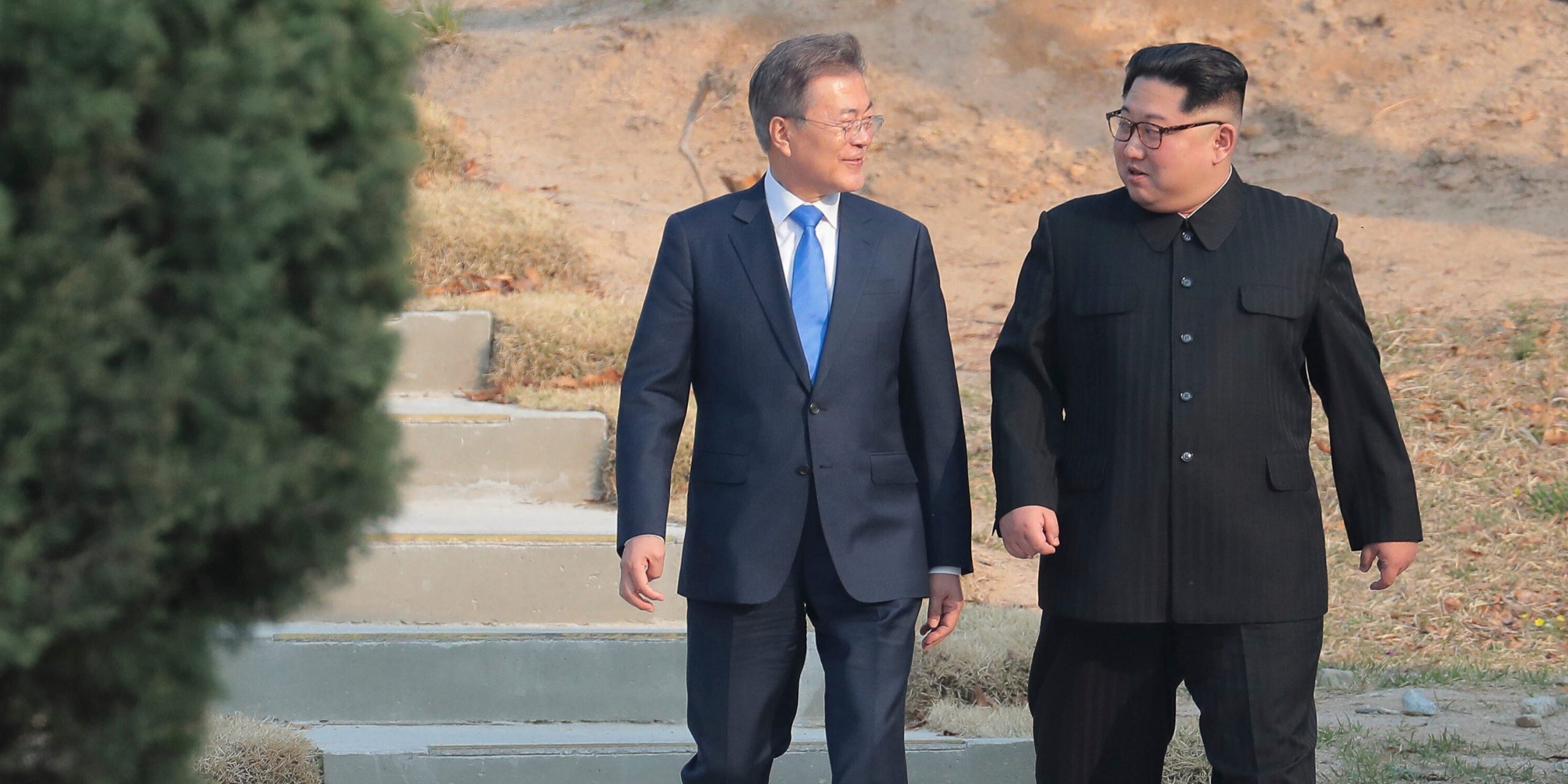 North Korean leader Kim Jong Un, right, and South Korean President Moon Jae-in stroll together at the border village of Panmunjom in the Demilitarized Zone, South Korea
